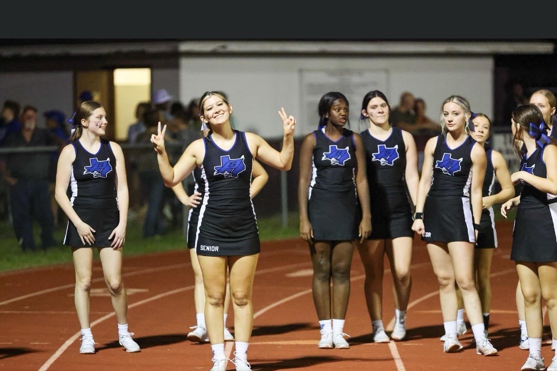 Cheerleader at football game