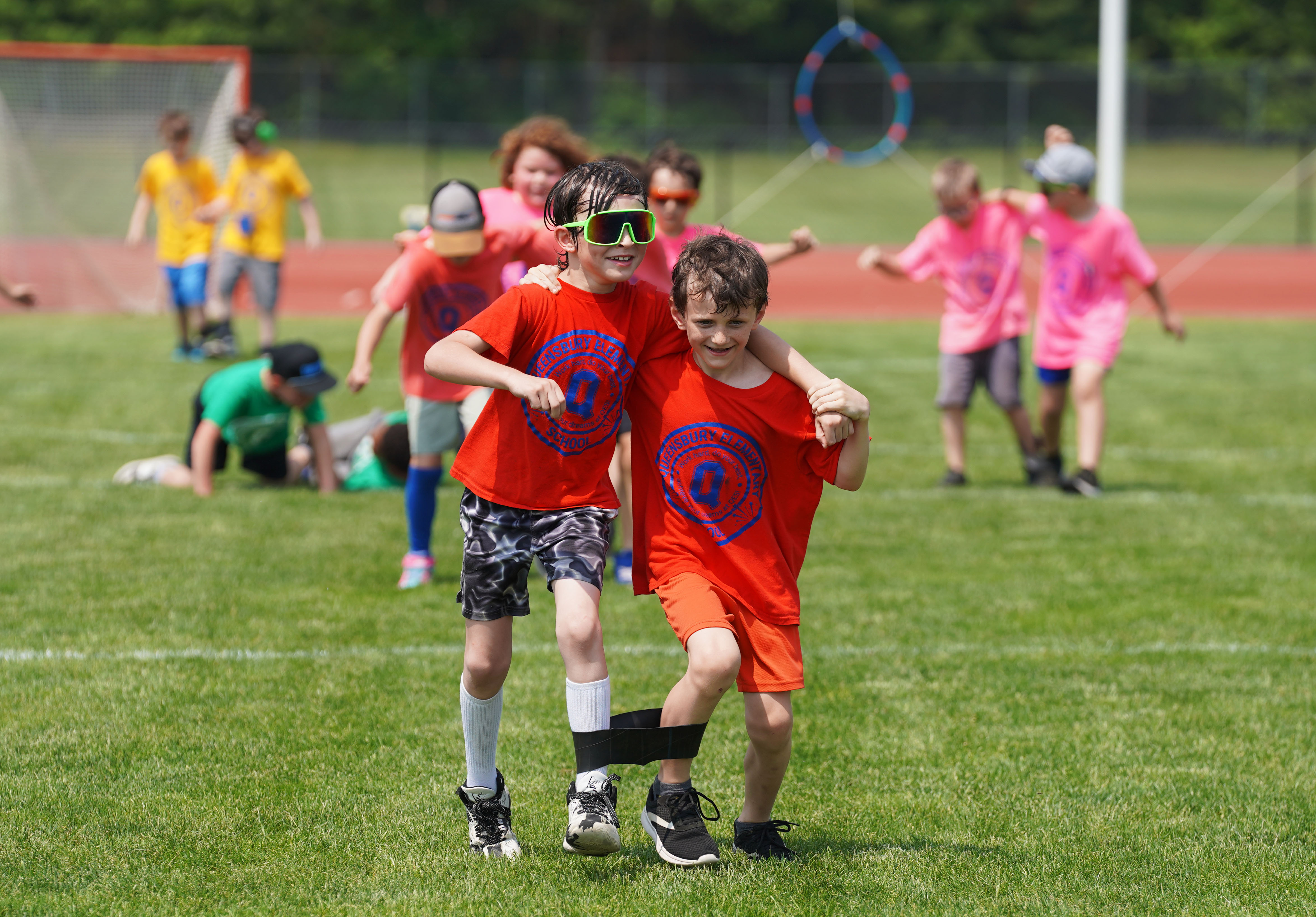 Two students compete in three-legged race.