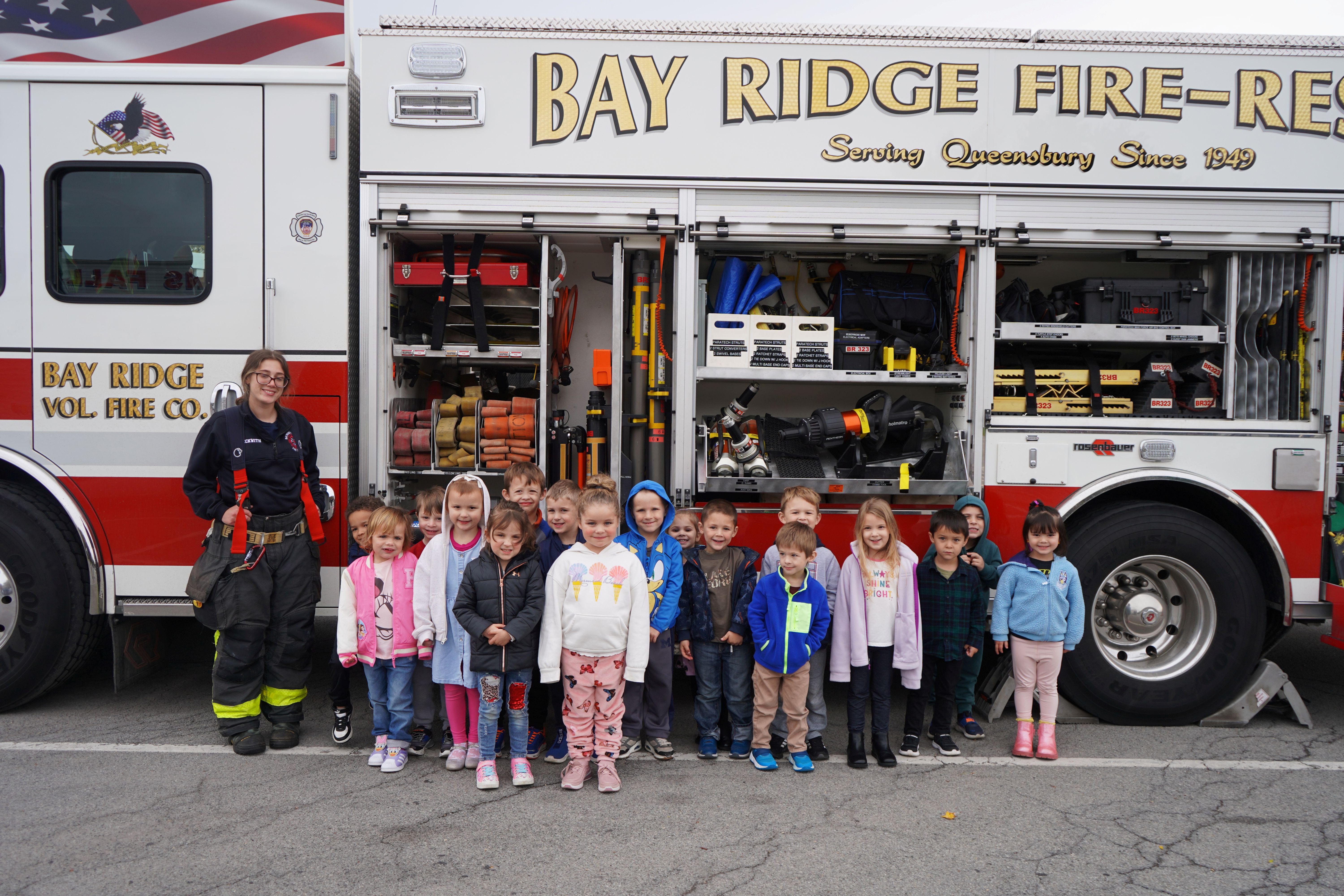 UPK students stand in front of fire truck.