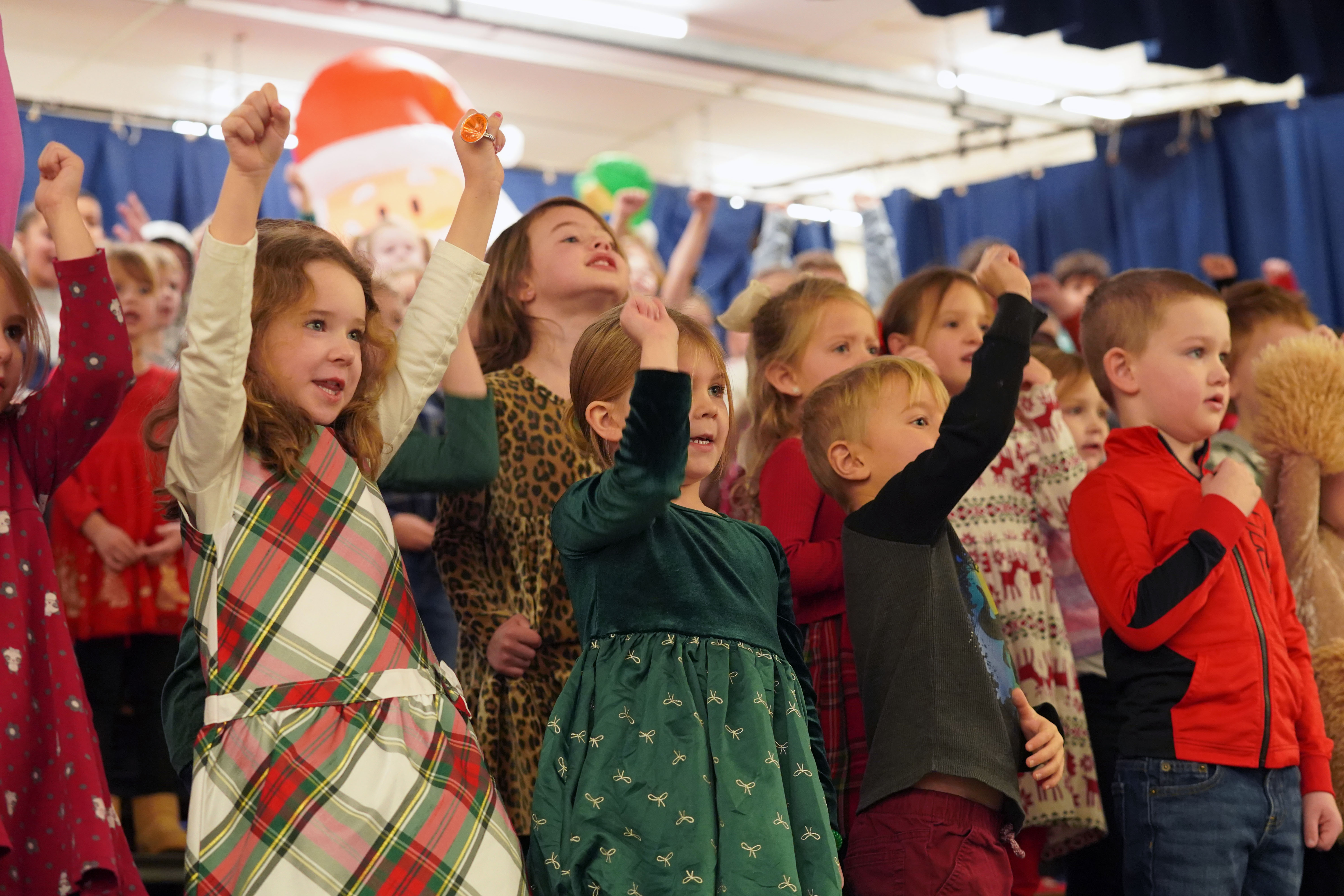 Children perform at Grandparents Breakfast.