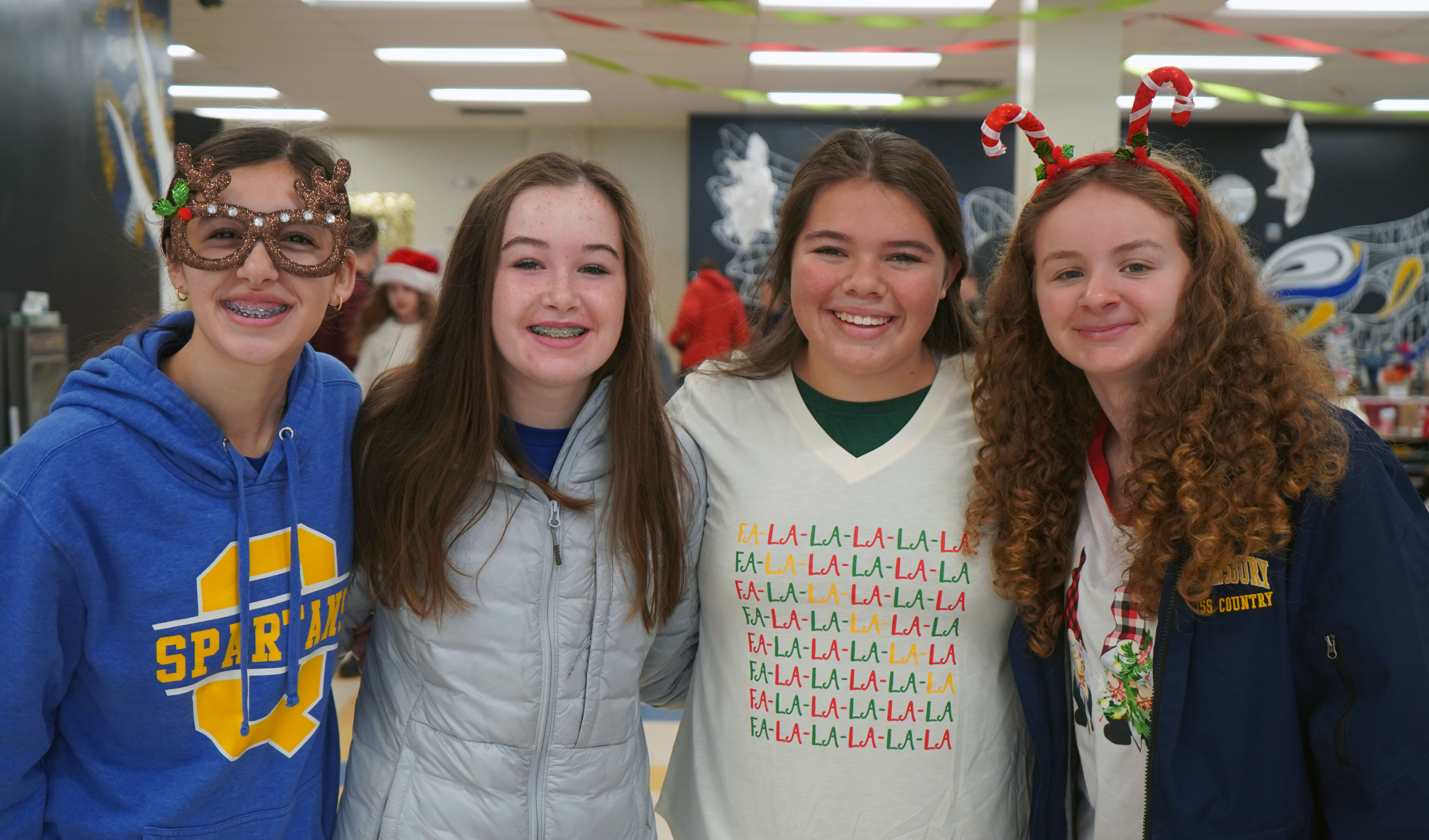 Middle schoolers serve pancakes at charity breakfast.