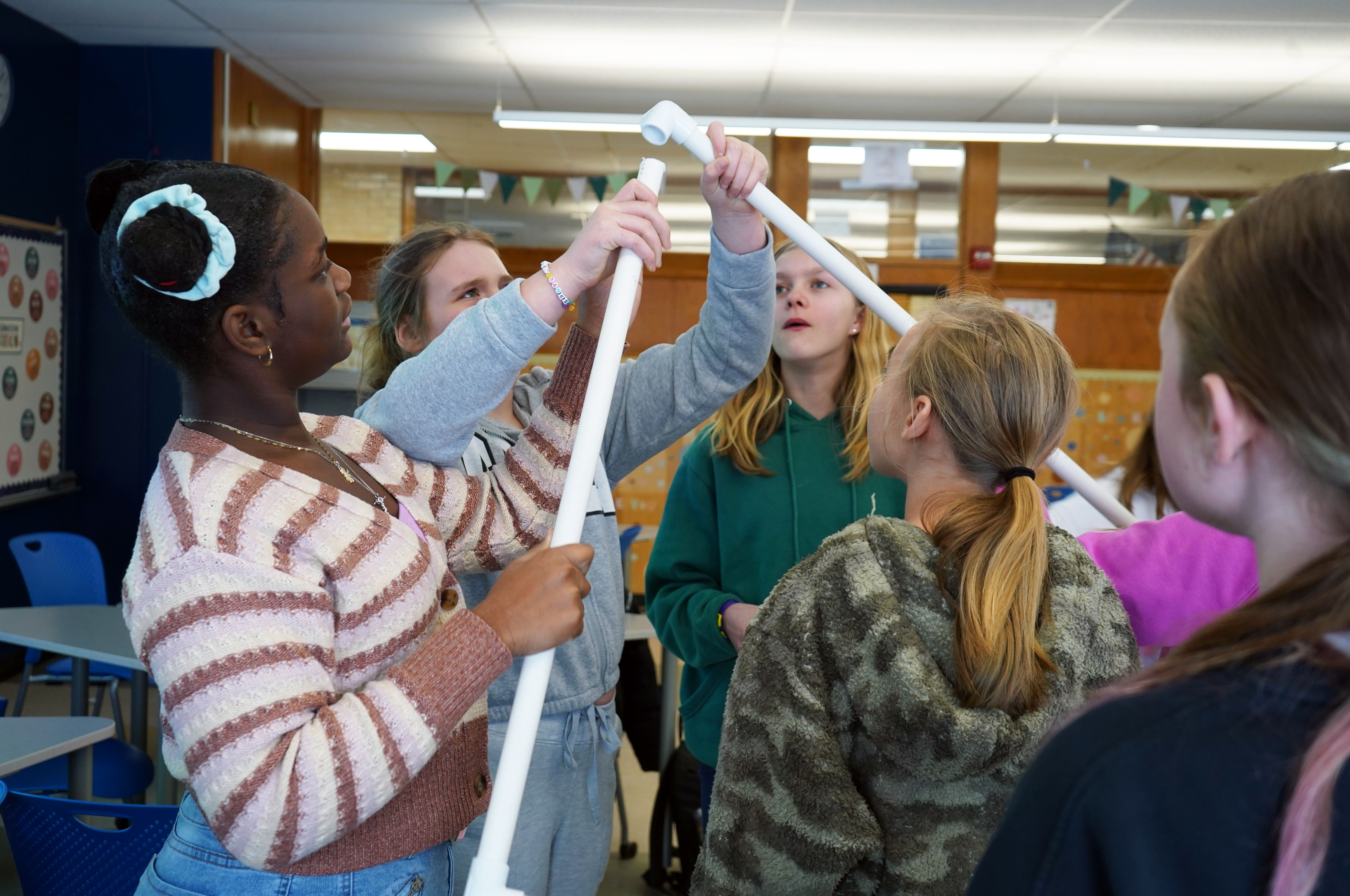 Girls work on technology project.