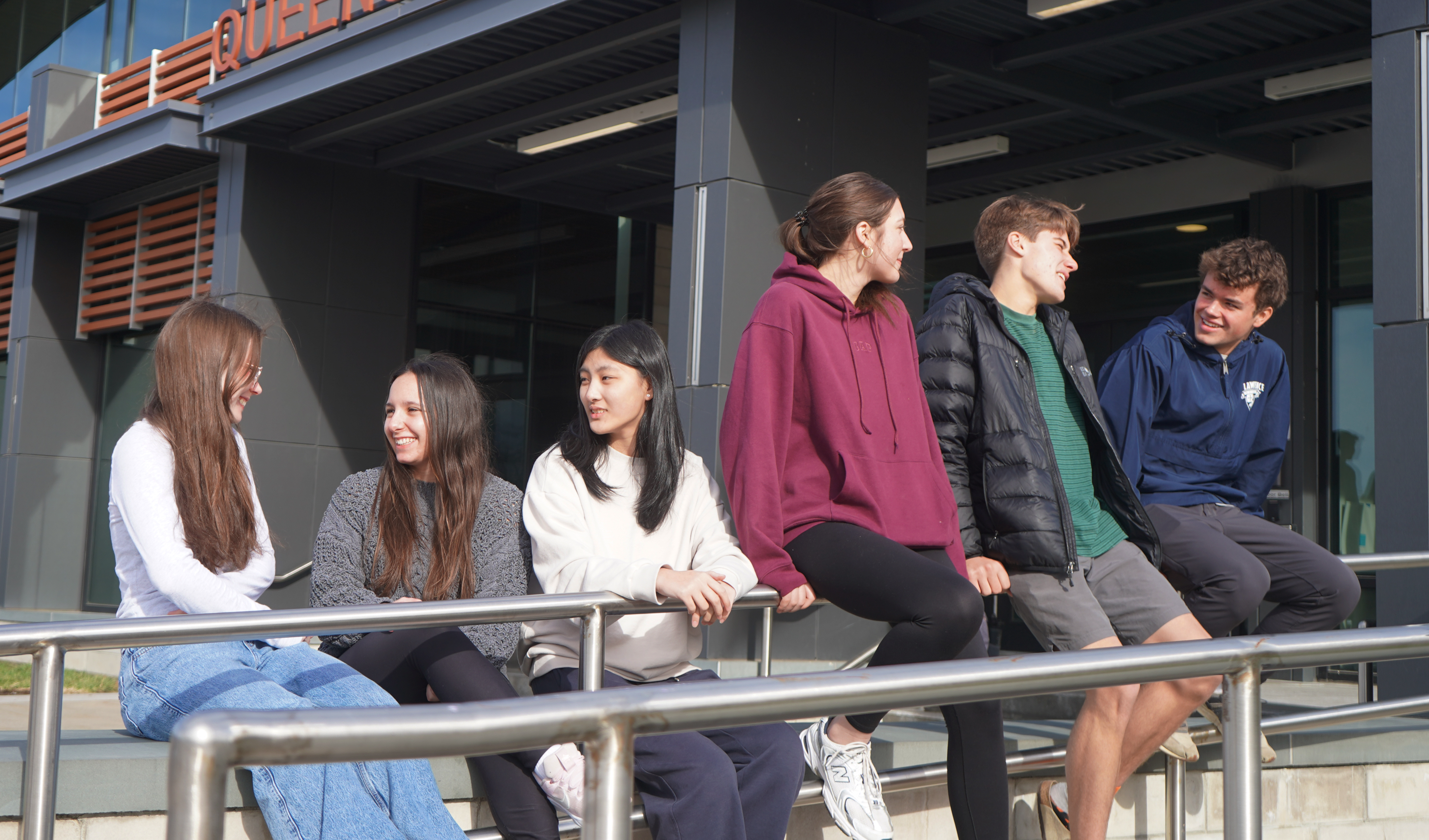 Students talk to each other outside of school.