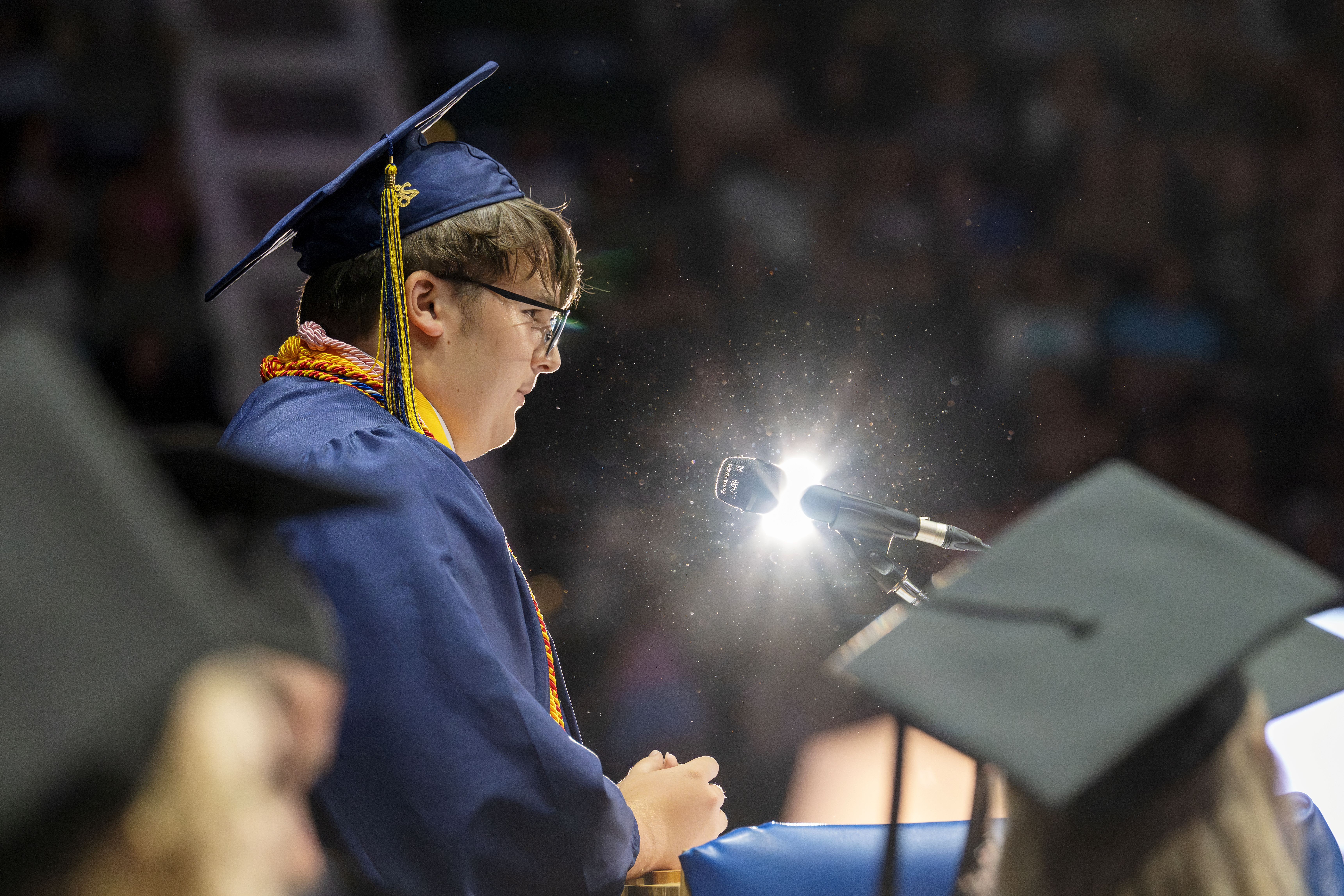 Student gives a speech at graduation.