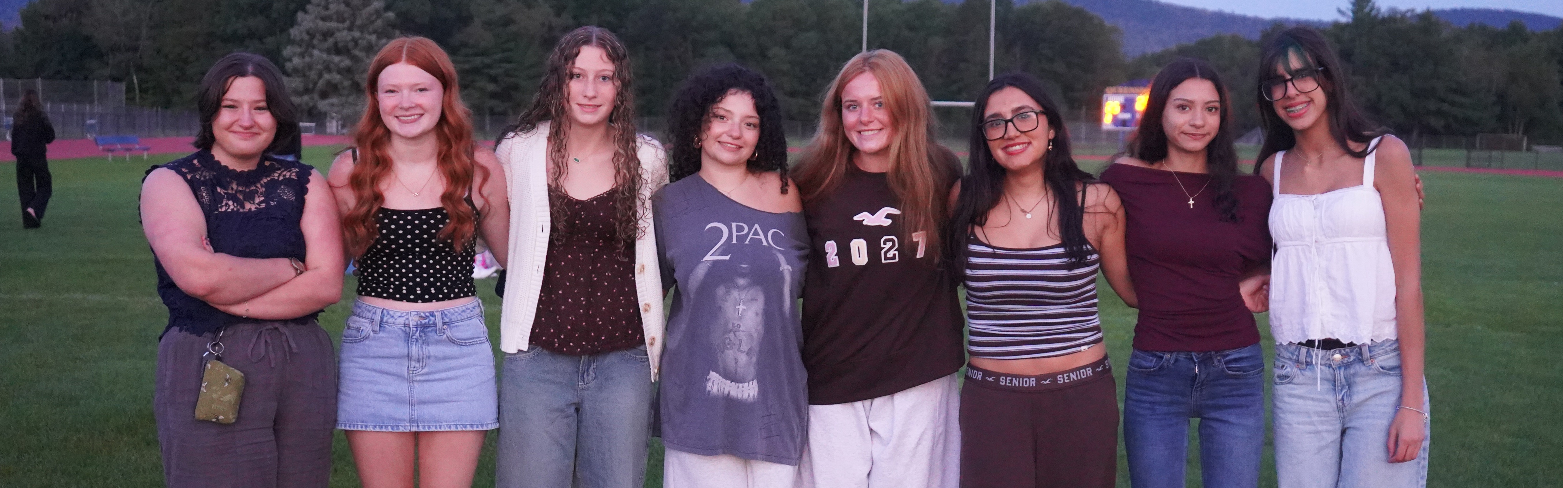 Seniors stand outside at the Senior Sunrise.