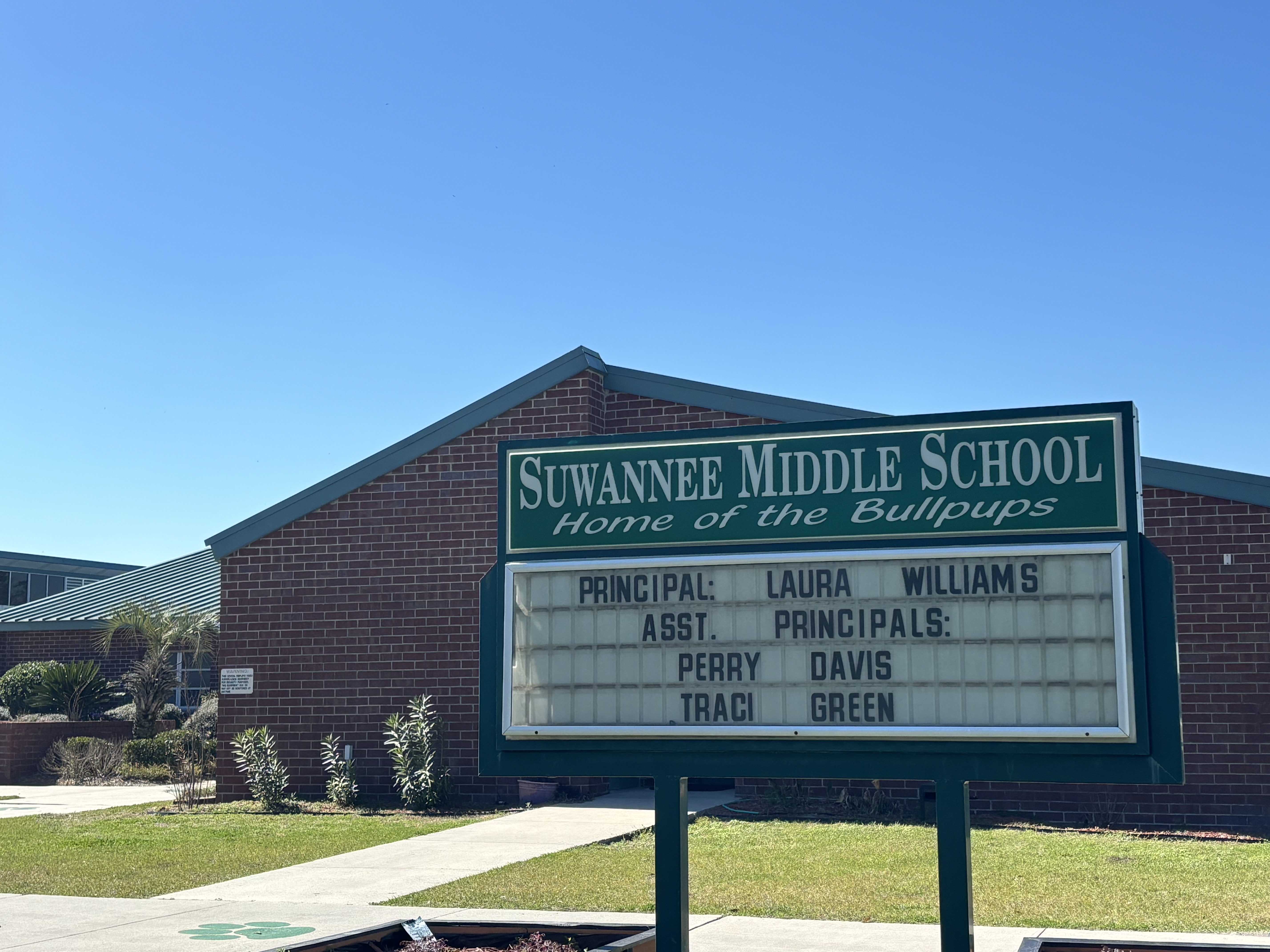 SMS welcome sign and front of school