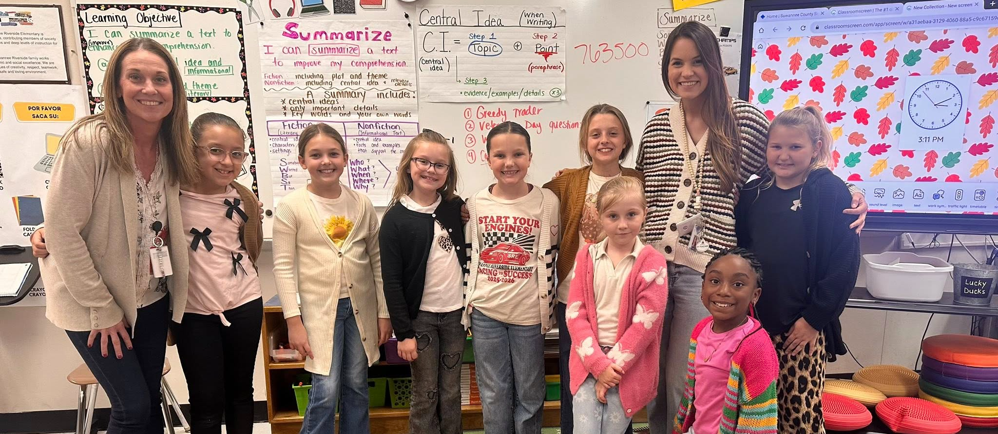 Students smiling in classroom 