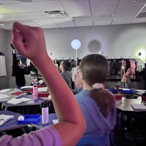 Female students learning the moon phases