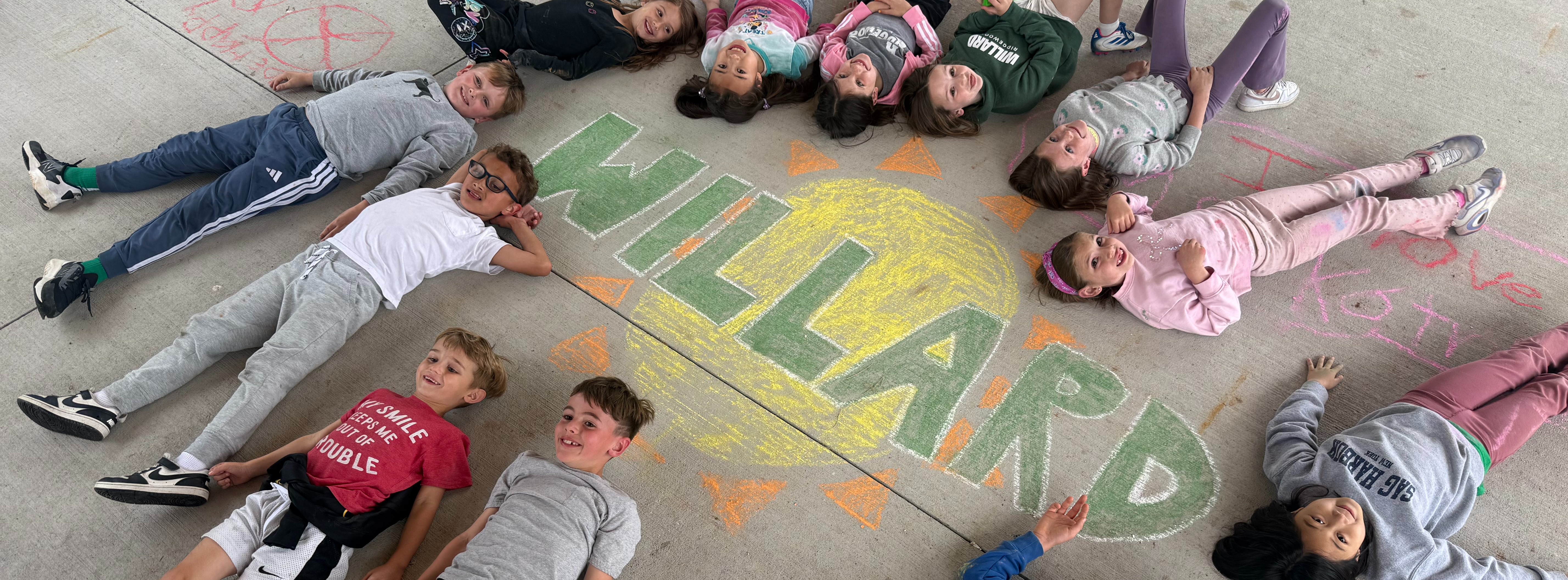 Students around Willard Sign