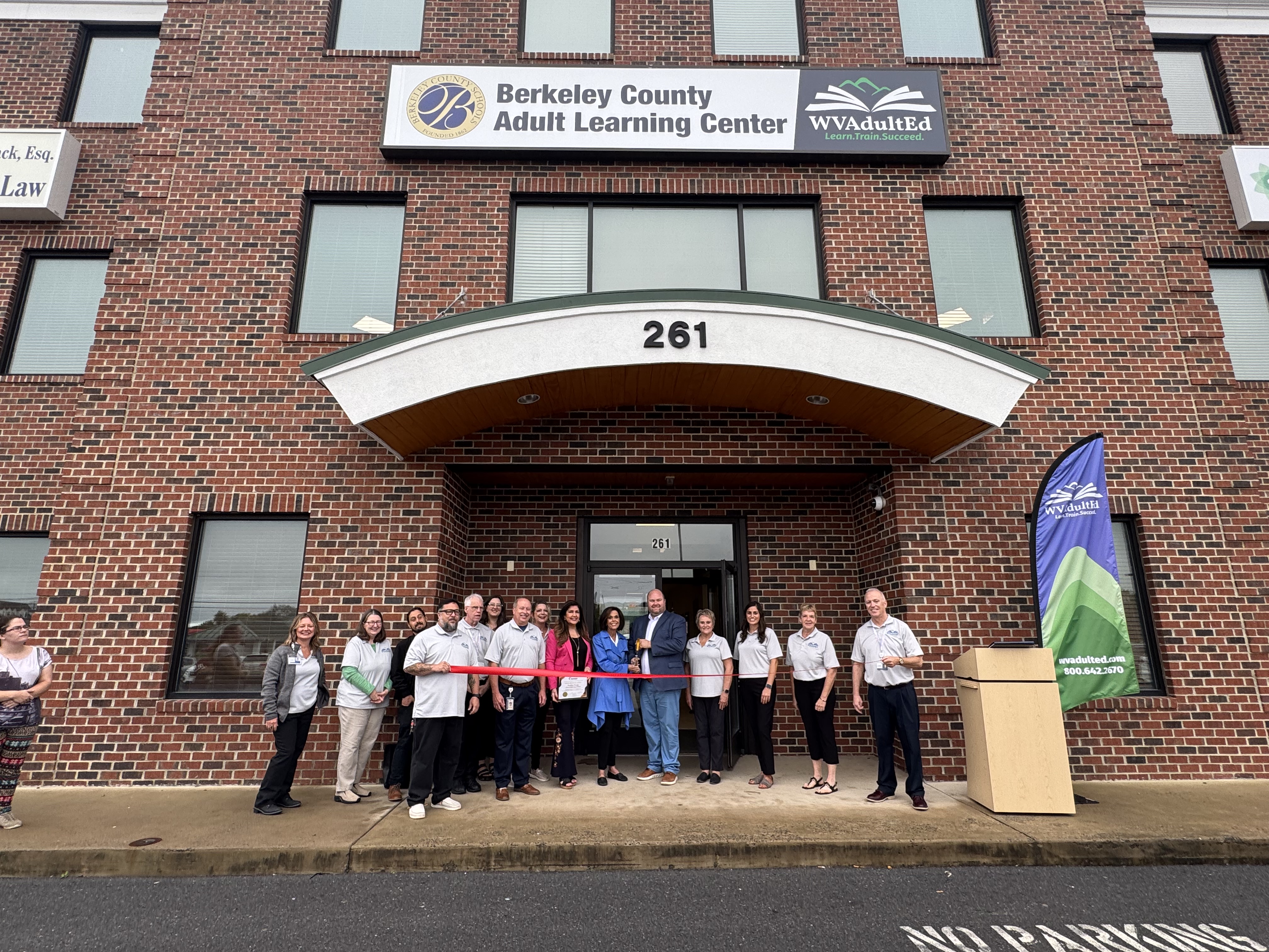 image of ribbon cutting ceremony at new adult learning center