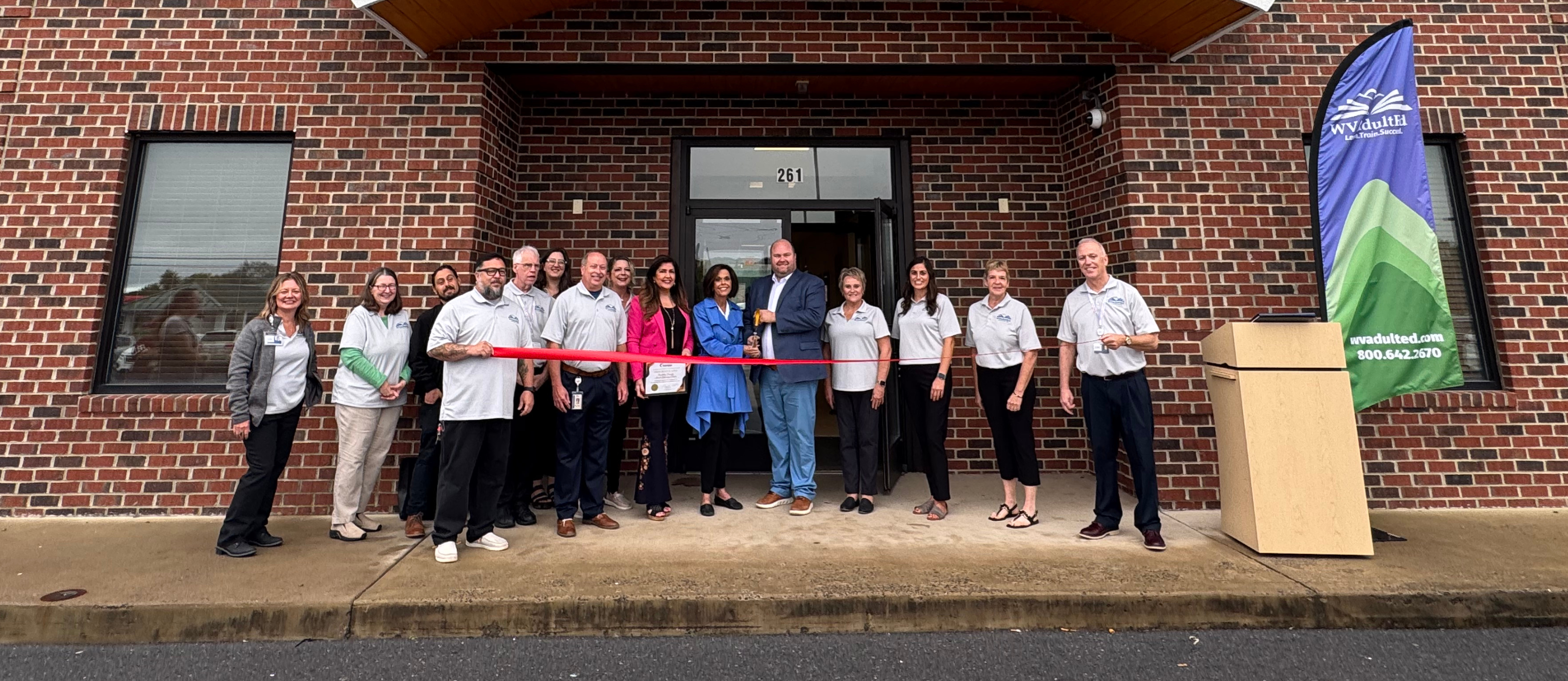 image of berkeley county adult learning center grand opening featuring staff cutting a ribbon