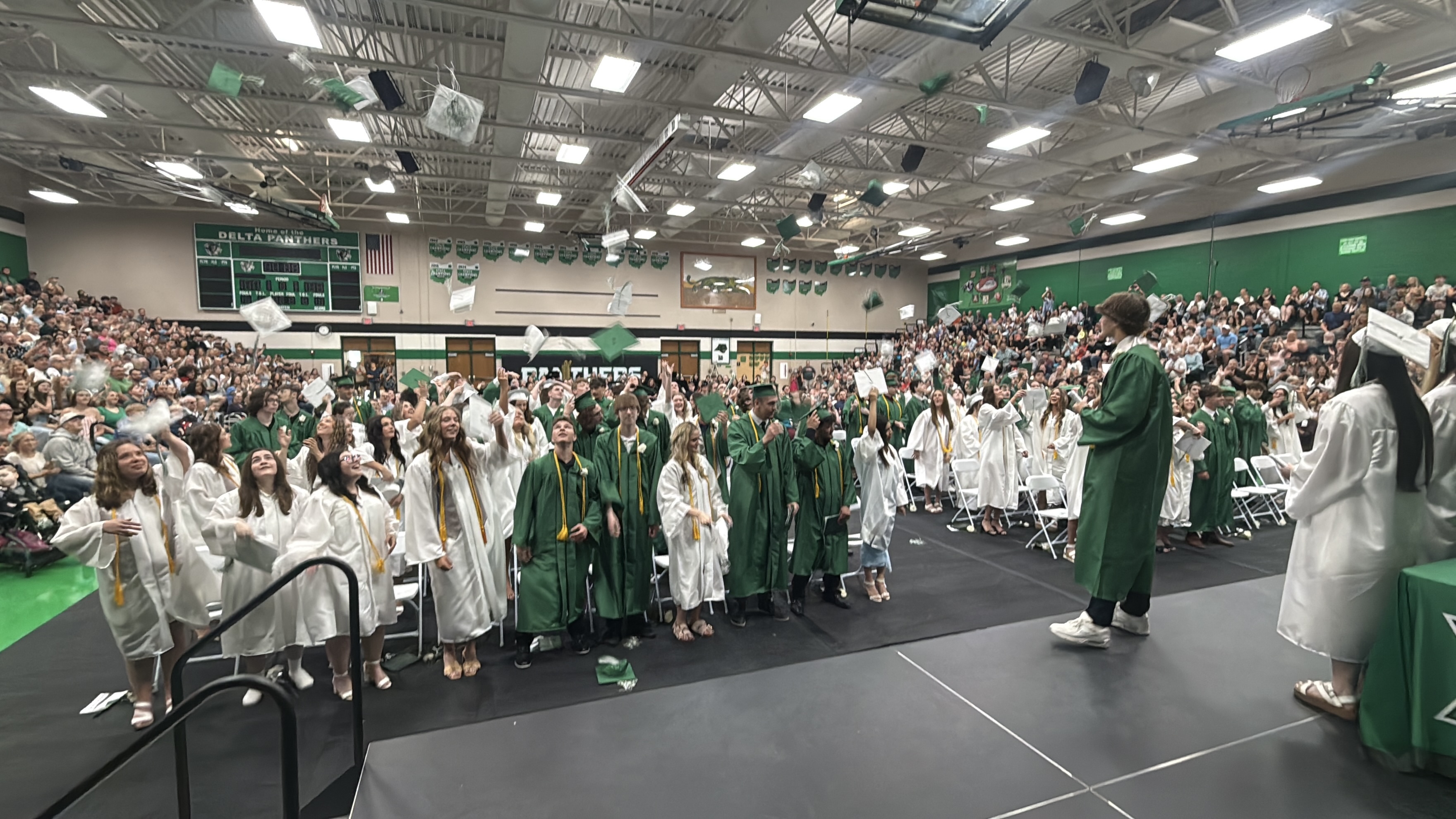 Students throwing their caps in the air at graduation