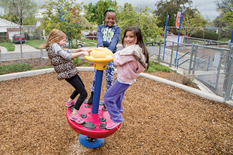 Three girls playing at the school playground