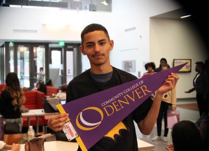 student with the denver flag