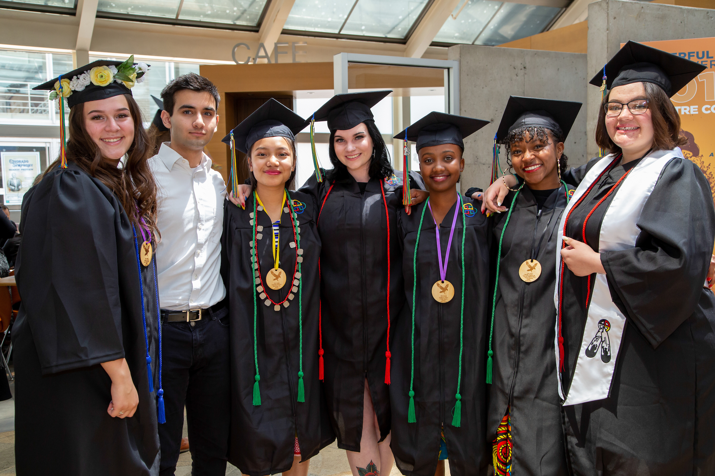 group of students in black graduation gowns