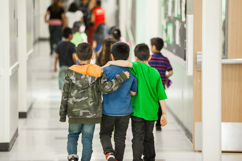Three boys on the school hallway