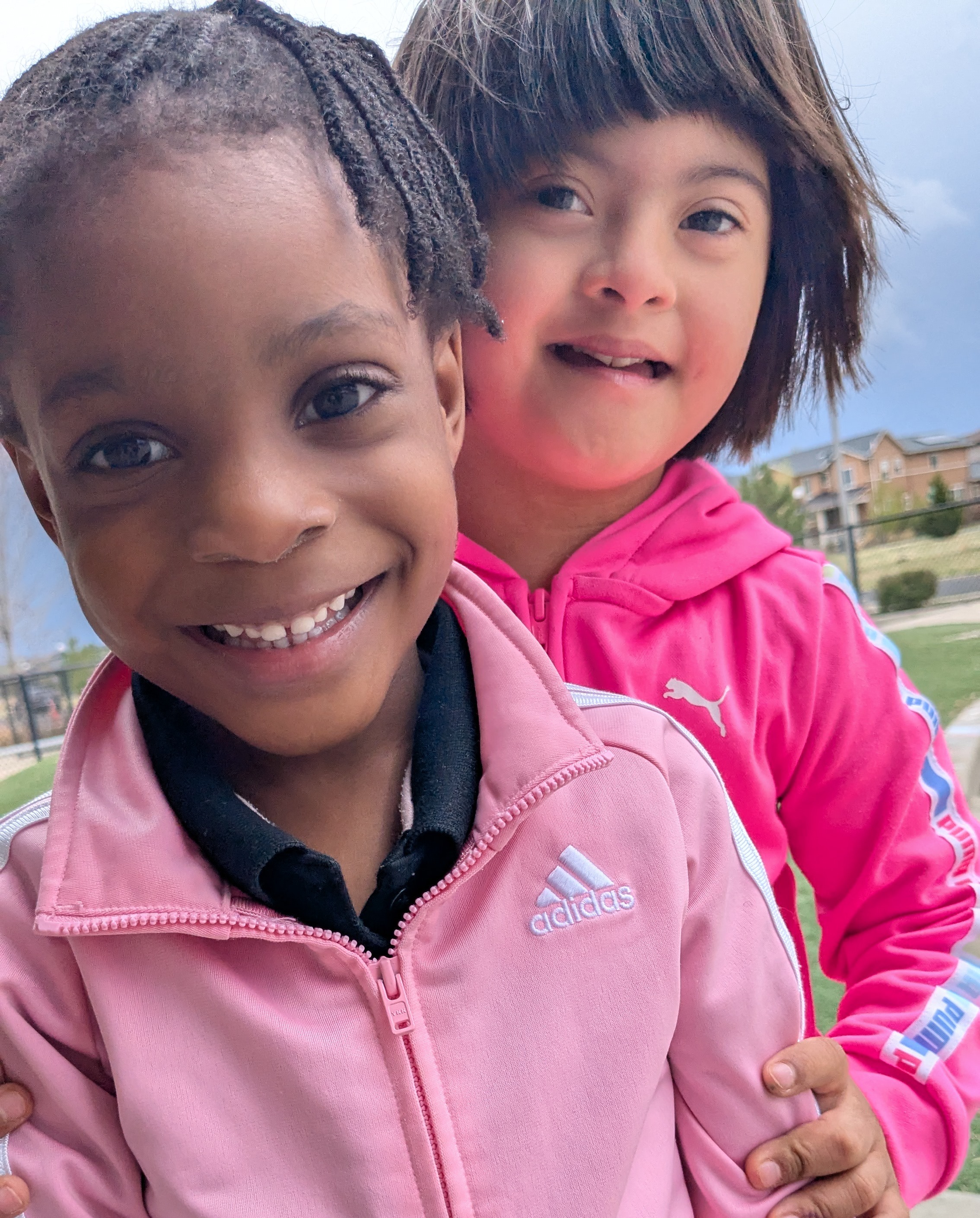 Two students smiling