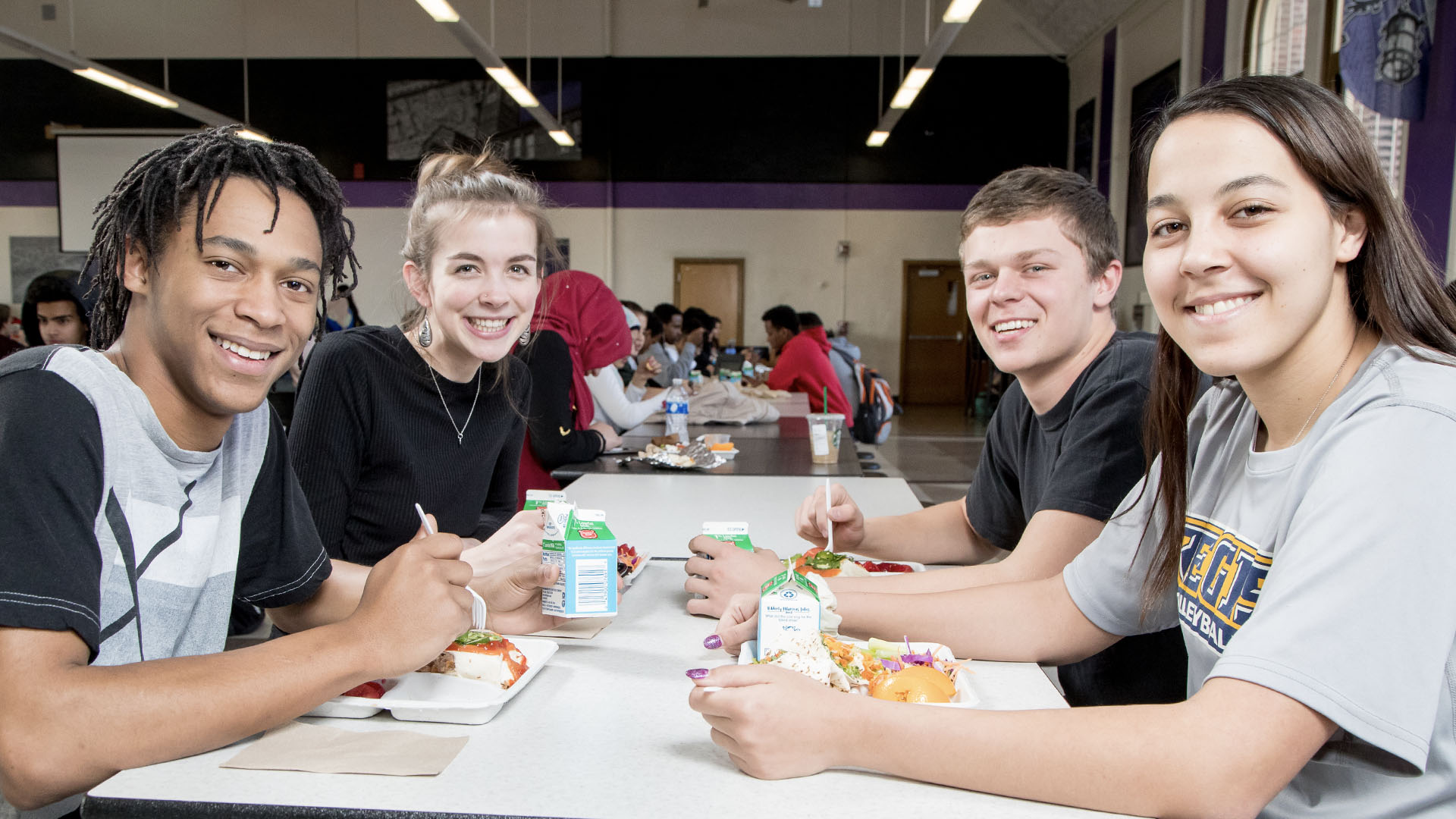 Students in cafeteria eating lunch