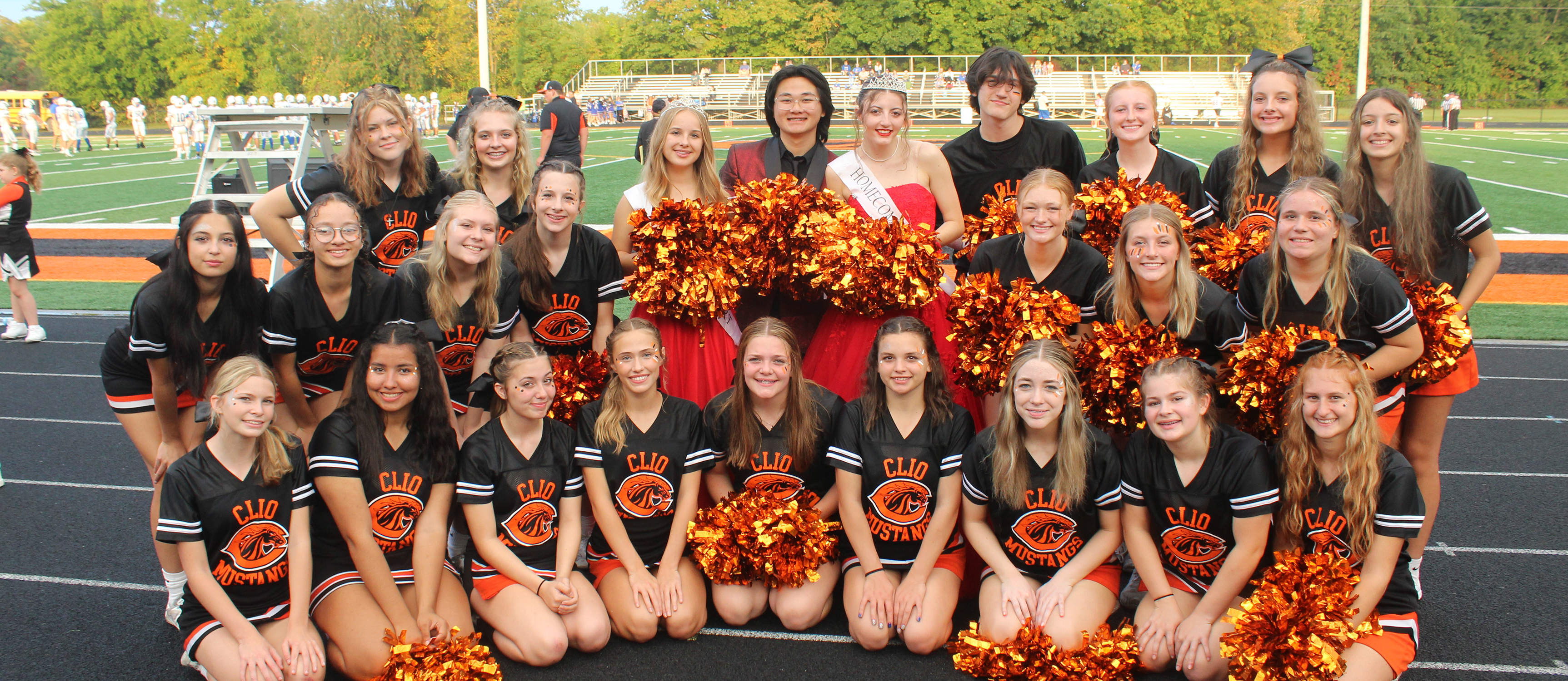 Photo of varsity cheerleaders posing as a group