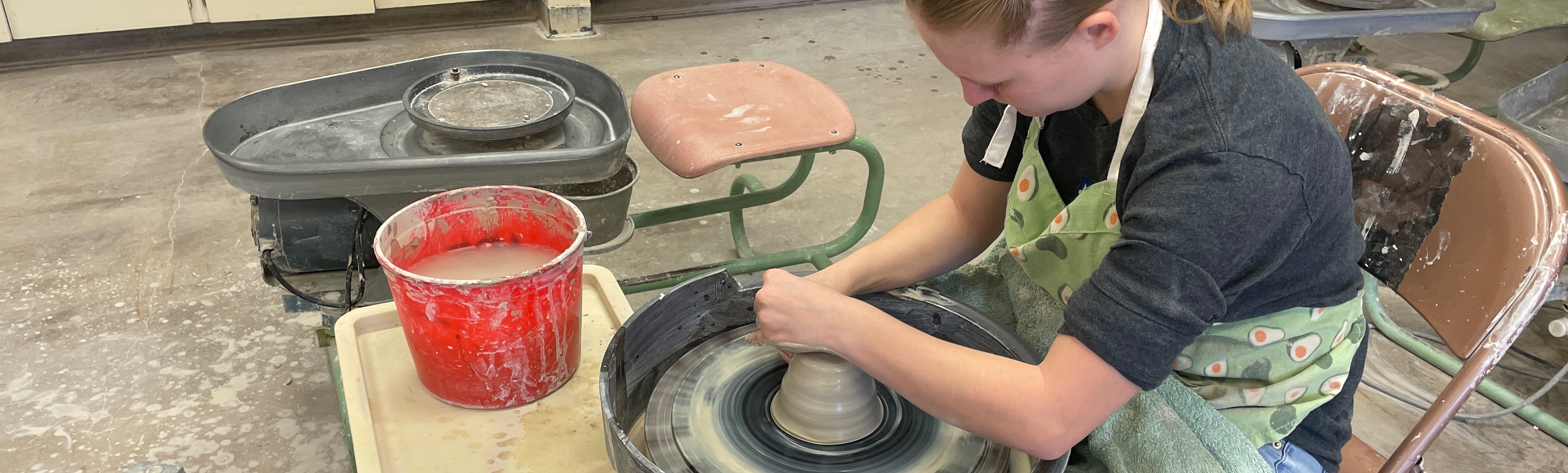 Student doing pottery