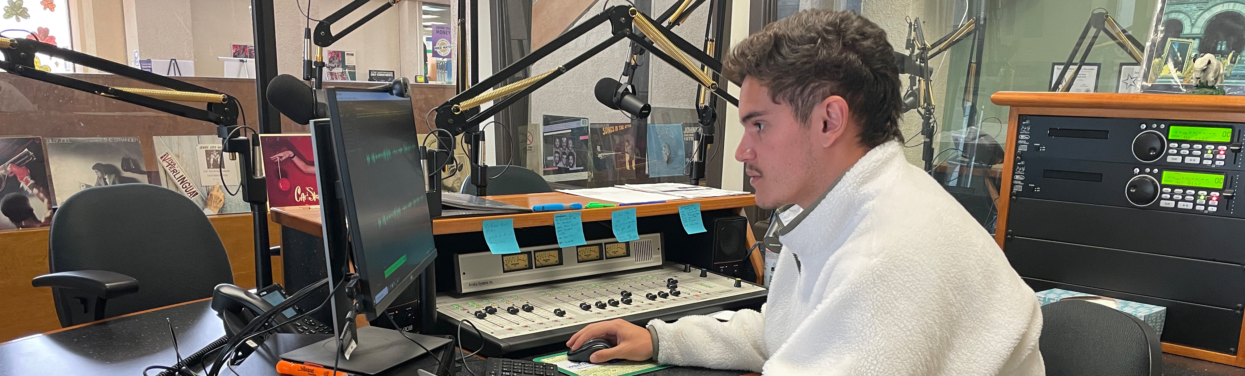 Student mixing audio on computer