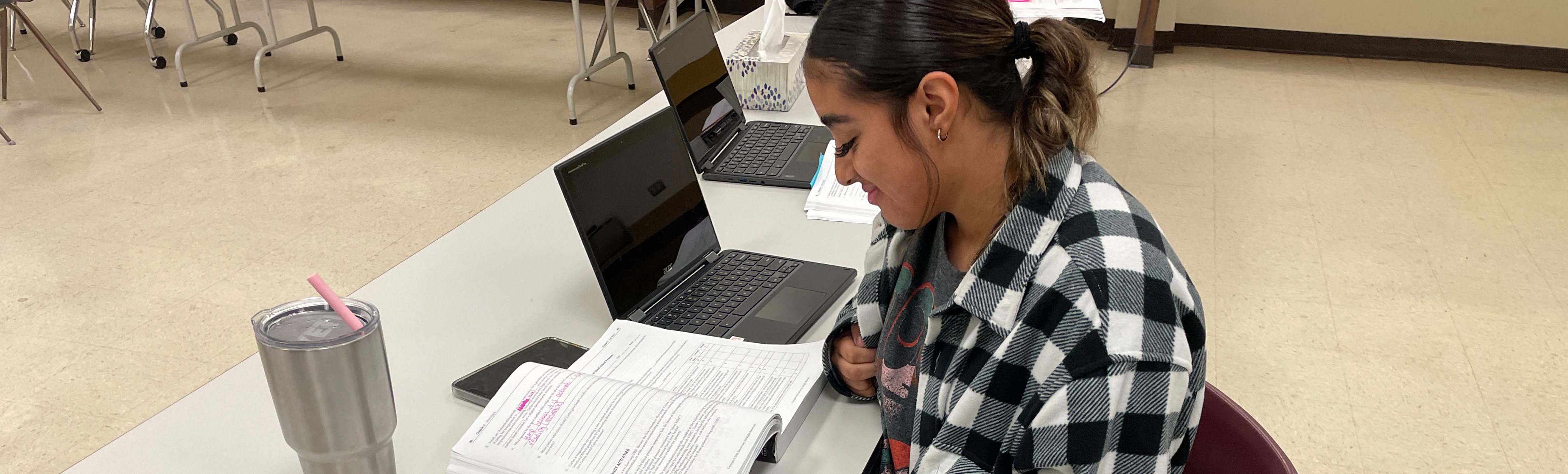 Student reading in Medical Assistant class