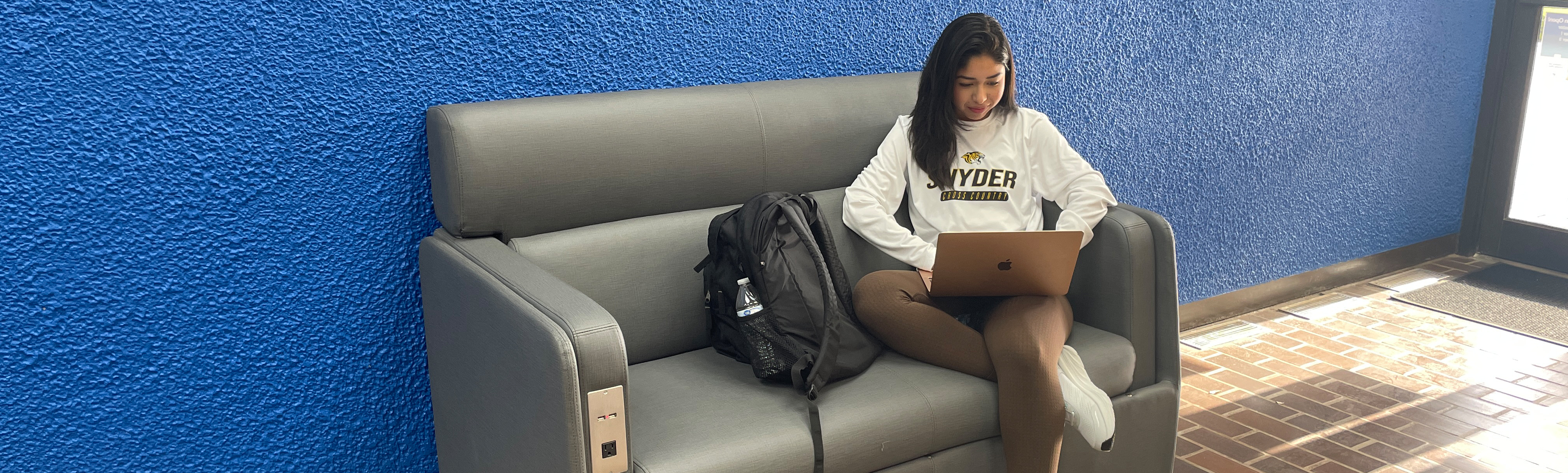 Student studying on couch