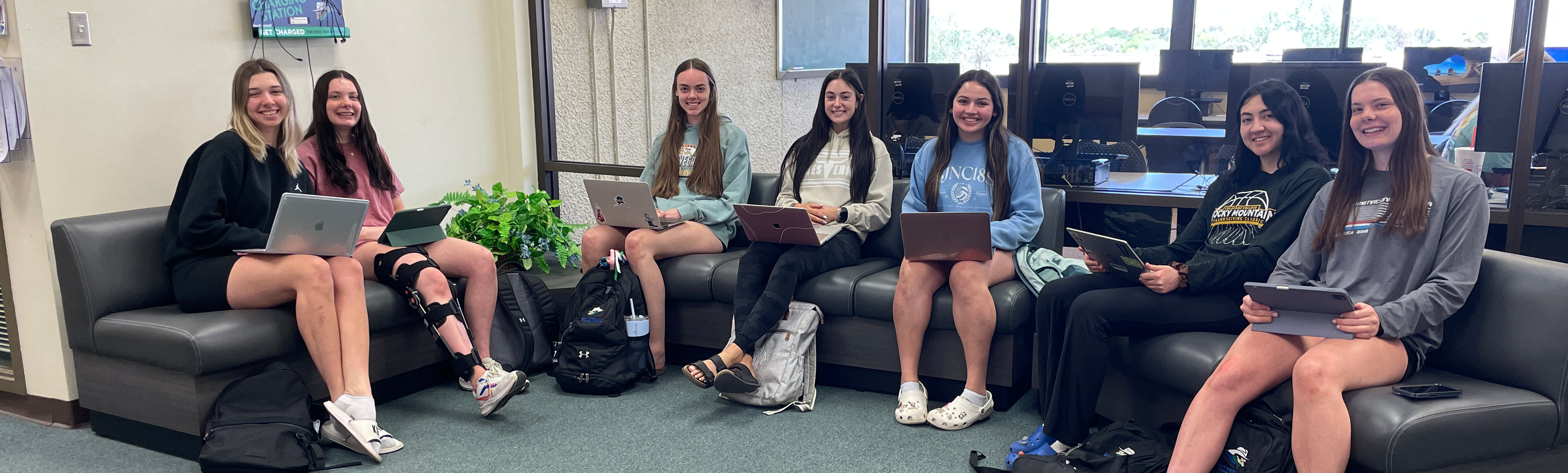 Students using laptops in Library