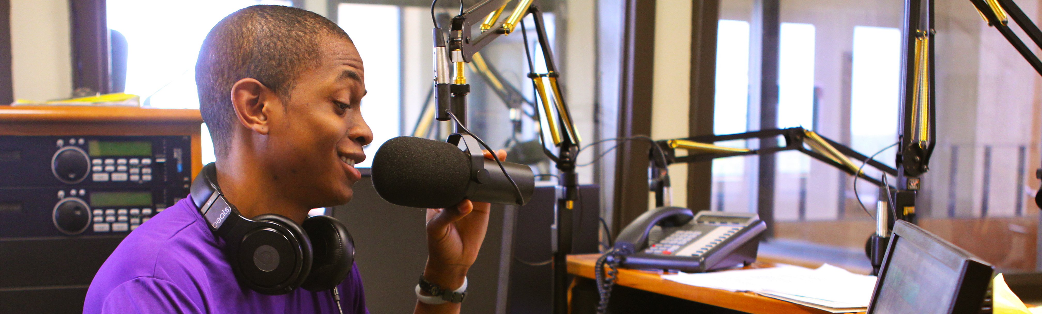 Student talking to radio station microphone