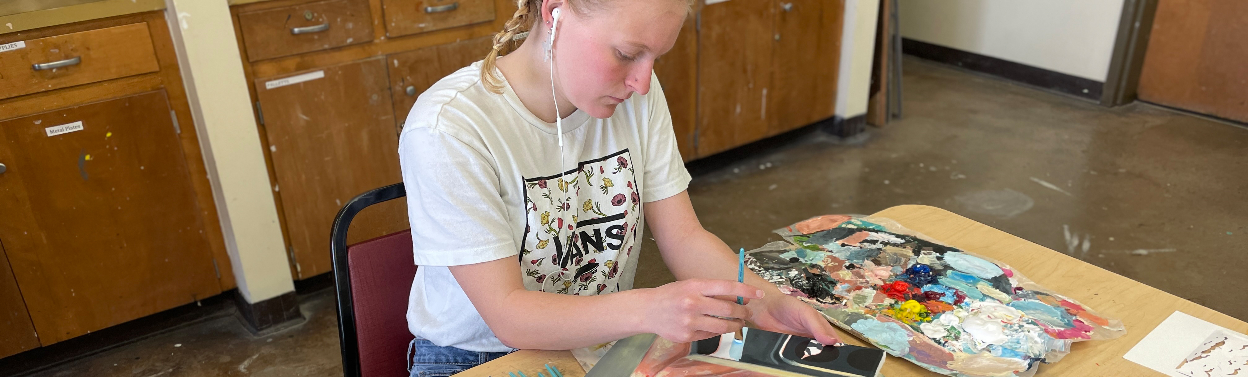 Student painting self portrait