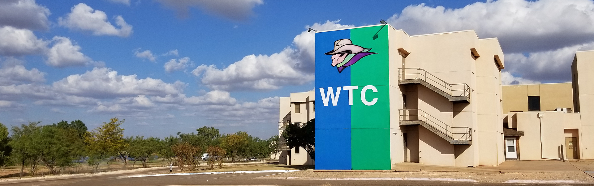 Side of old dorms with WTC and Wersterner painted