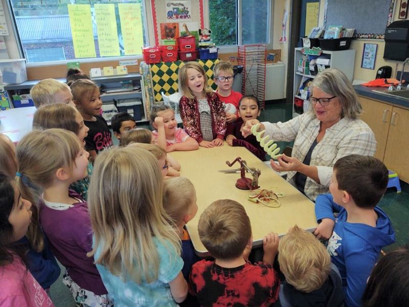 Kids in class with their teacher