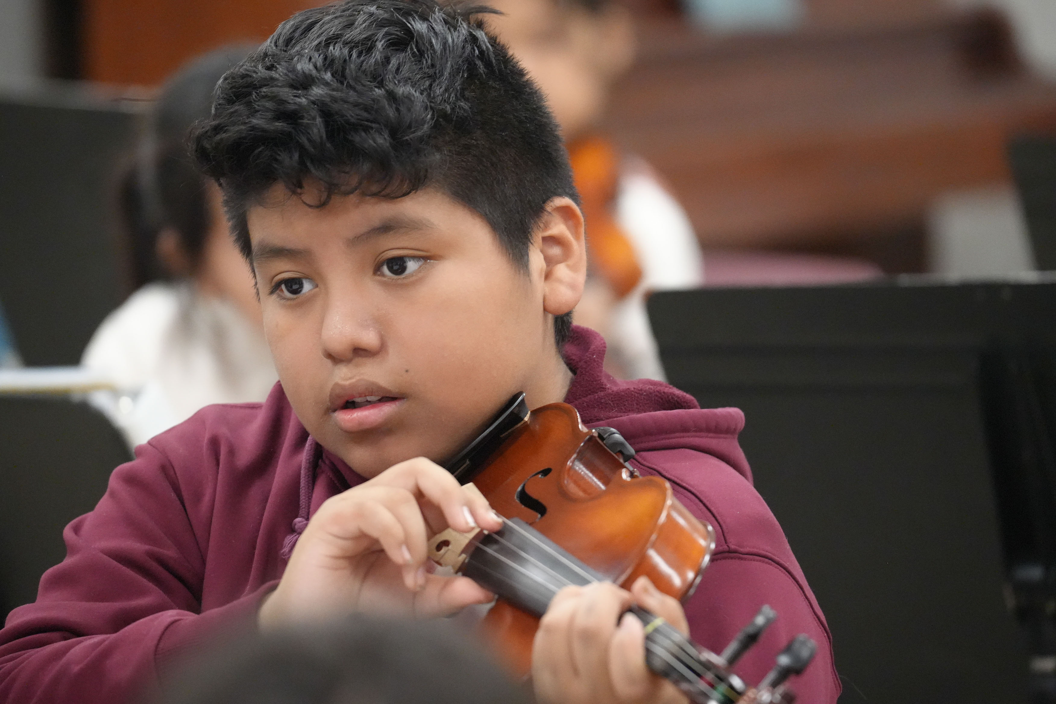 SCE Student playing violin.