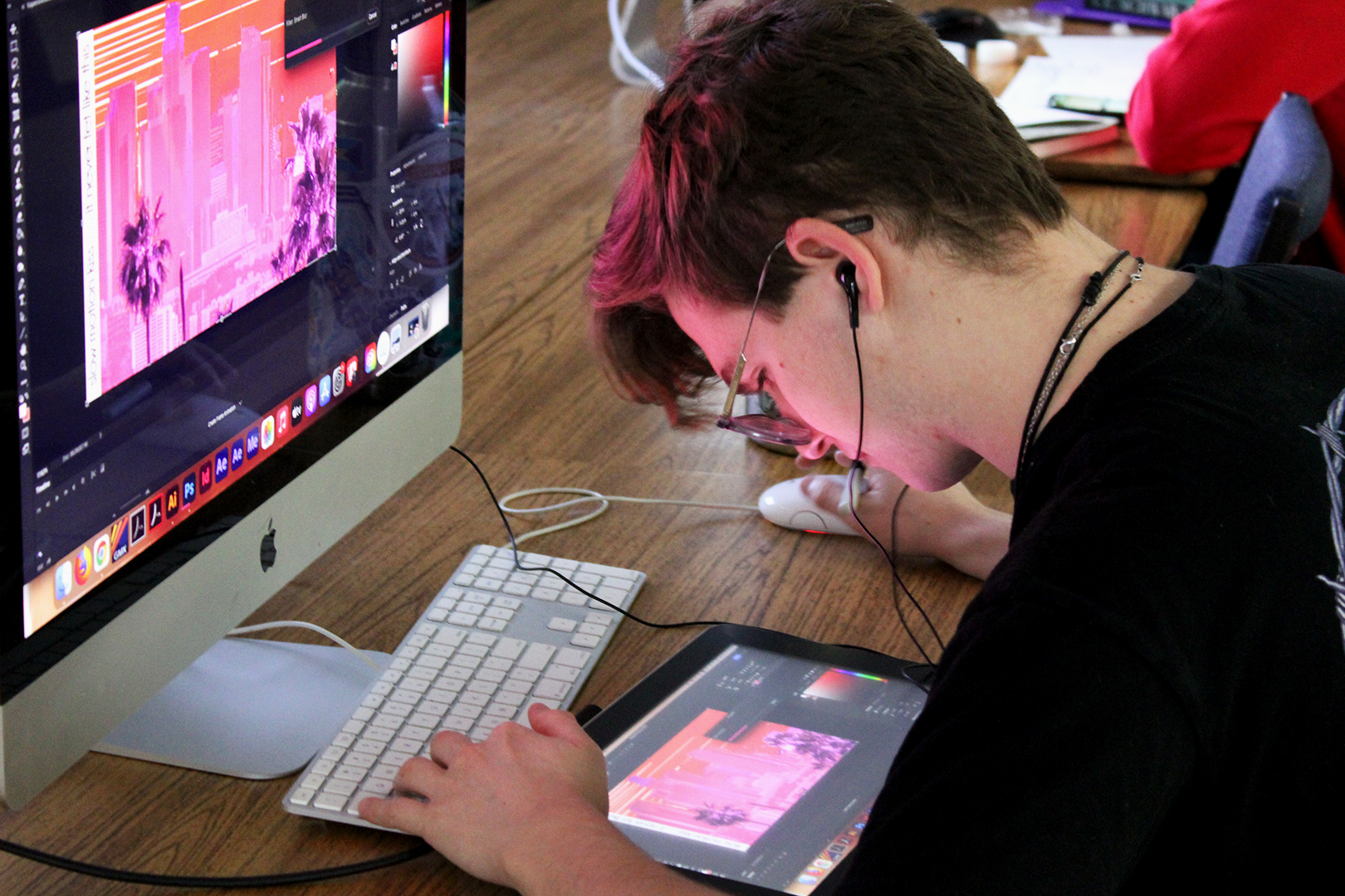 Art student creating a design on a computer