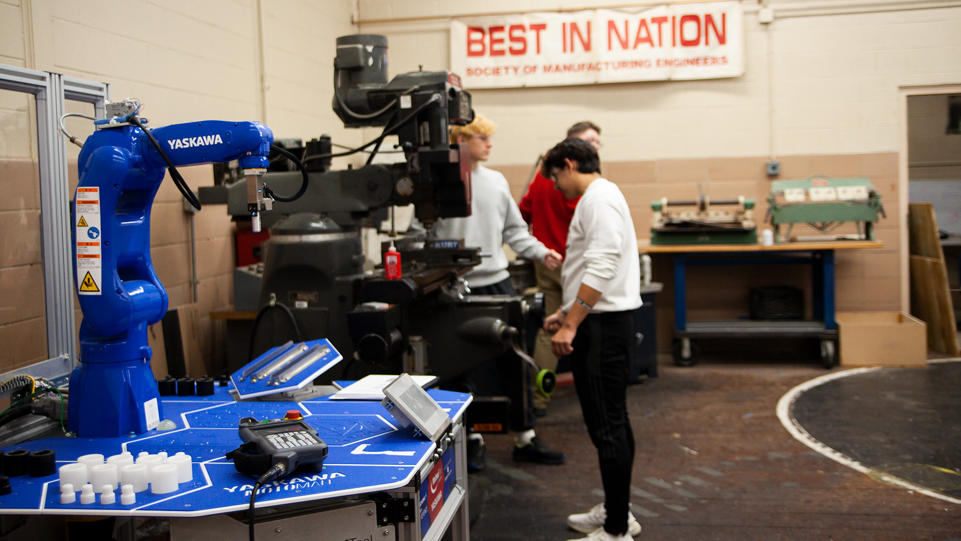 A blue robot in an engineering lab