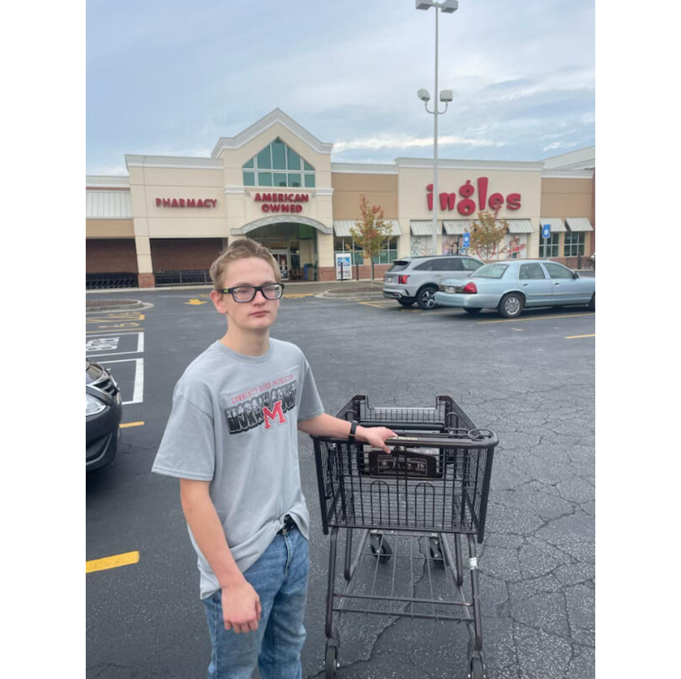 A student with a shopping cart