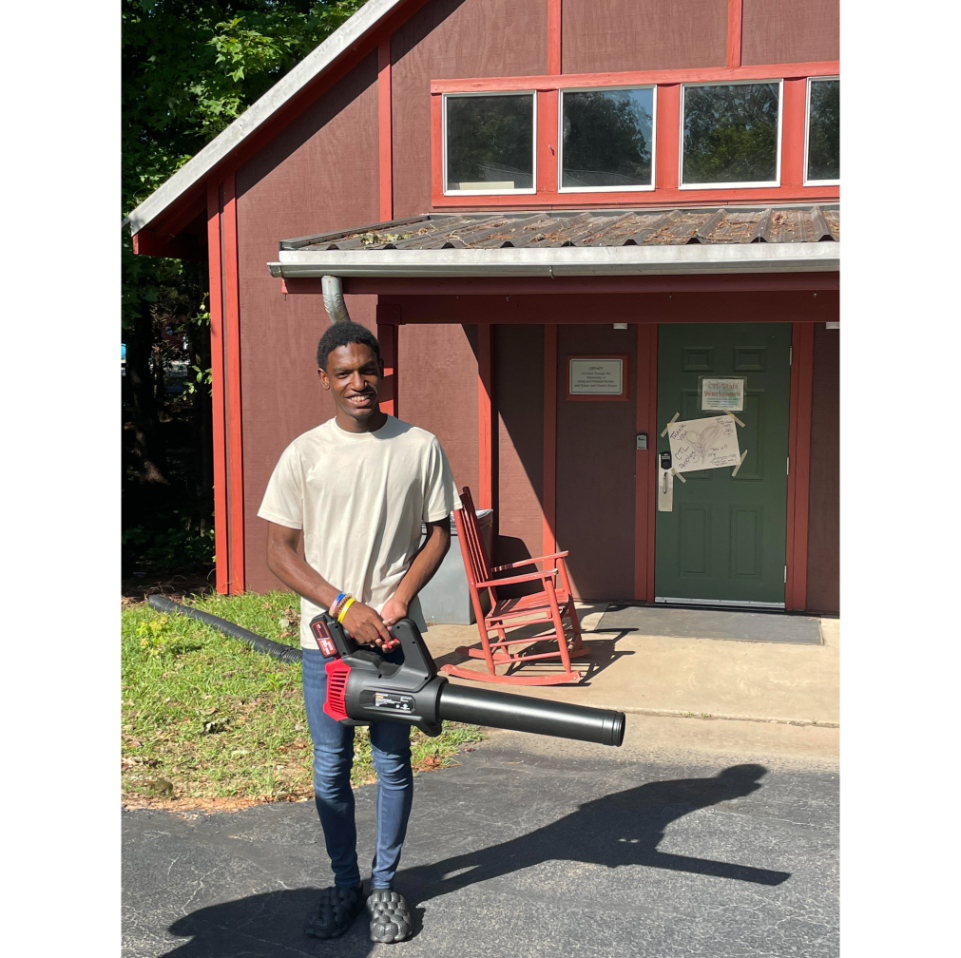 Student with a leaf blower