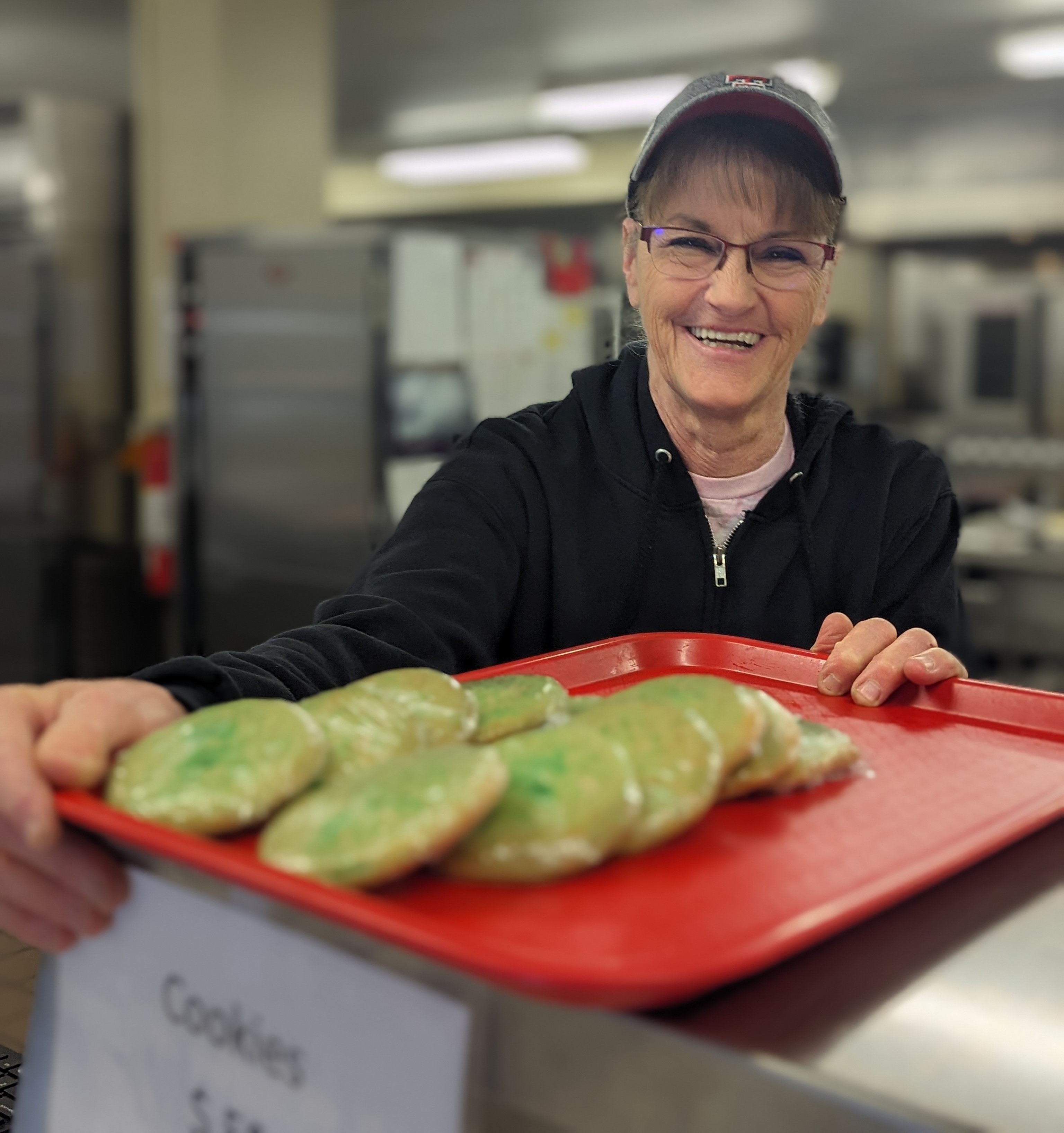 cafeteria worker with cookies