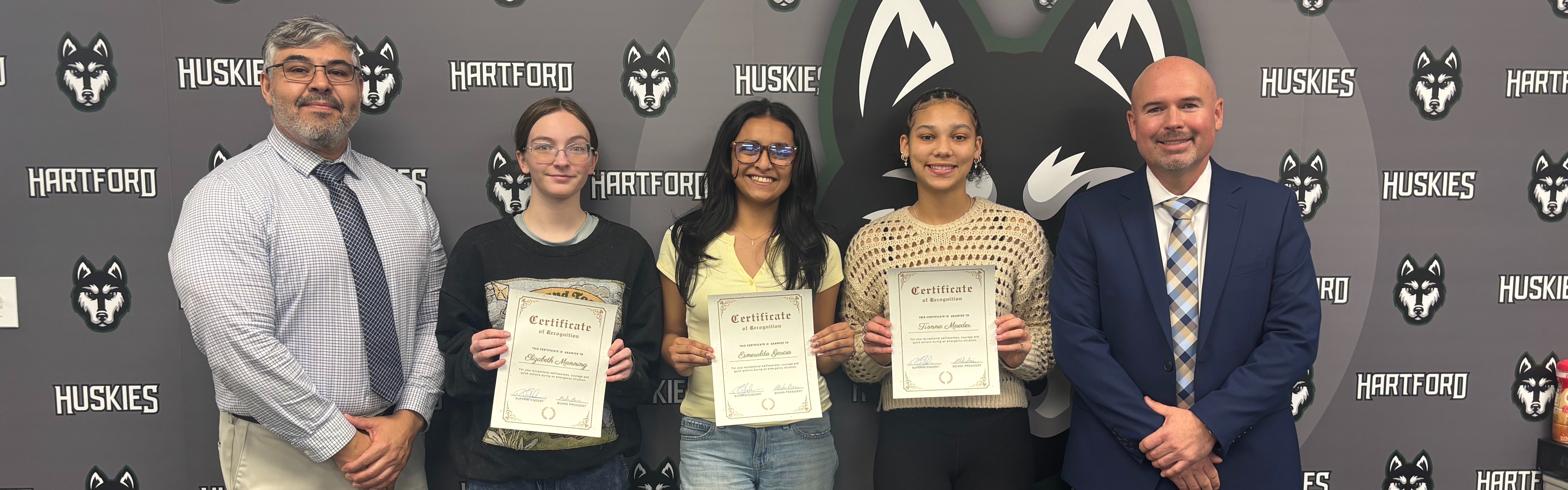 Ti'onna Maeder, Esmeralda Garcia, and Elizabeth Manning with principal robles and superintendent blackmer