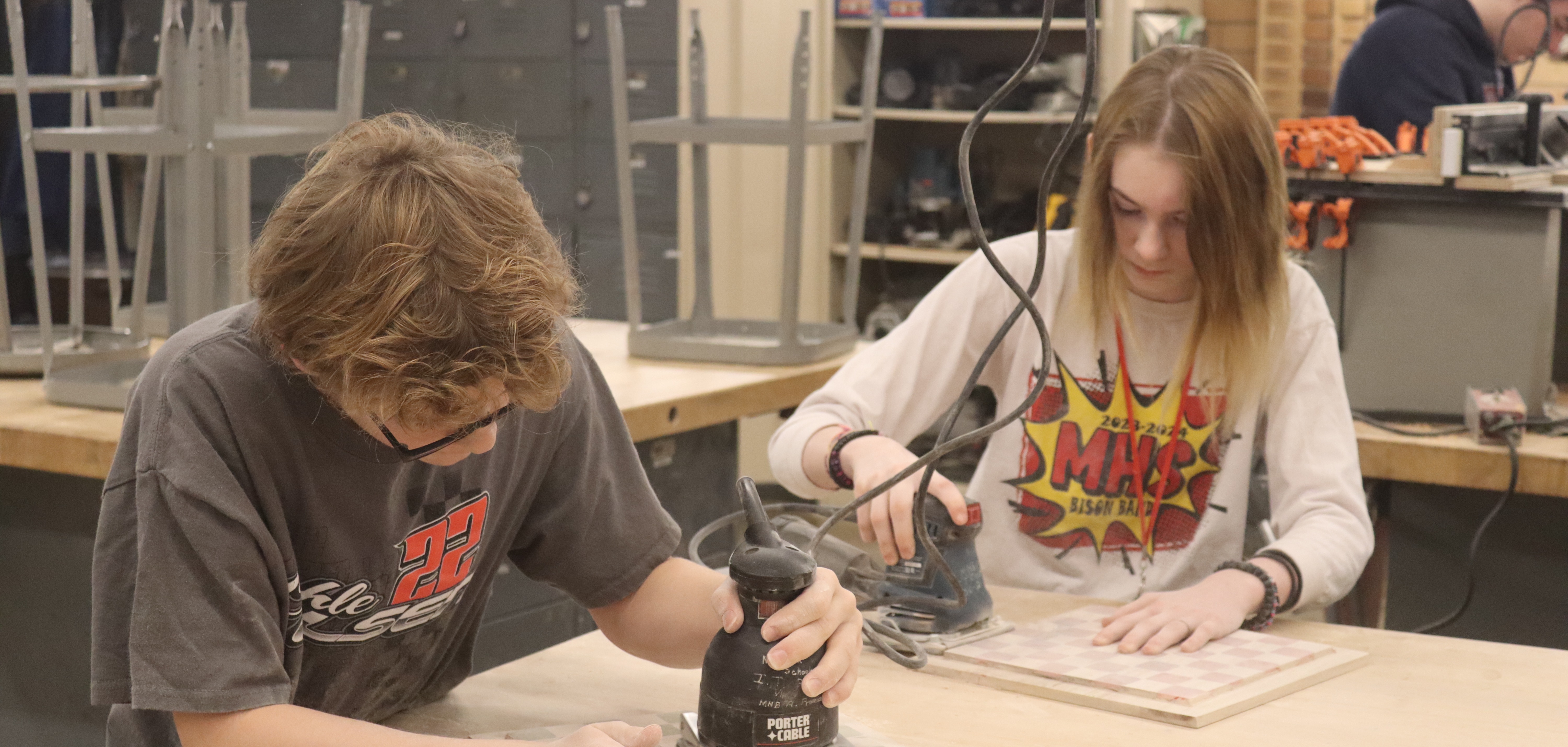 students sanding in woods class