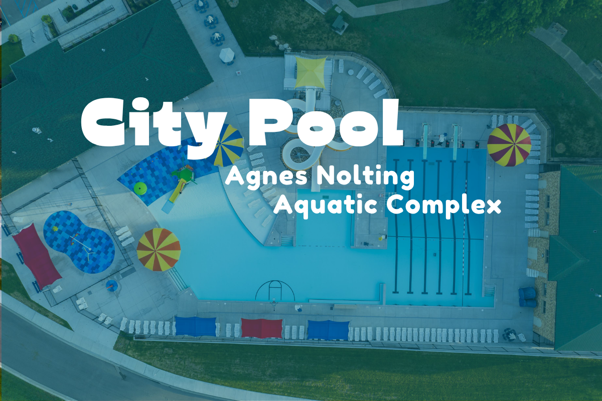 Agnes Nolting Aquatic Center Pool with slide and buildings with text reading City Pool Agnes Nolting Aquatic Center