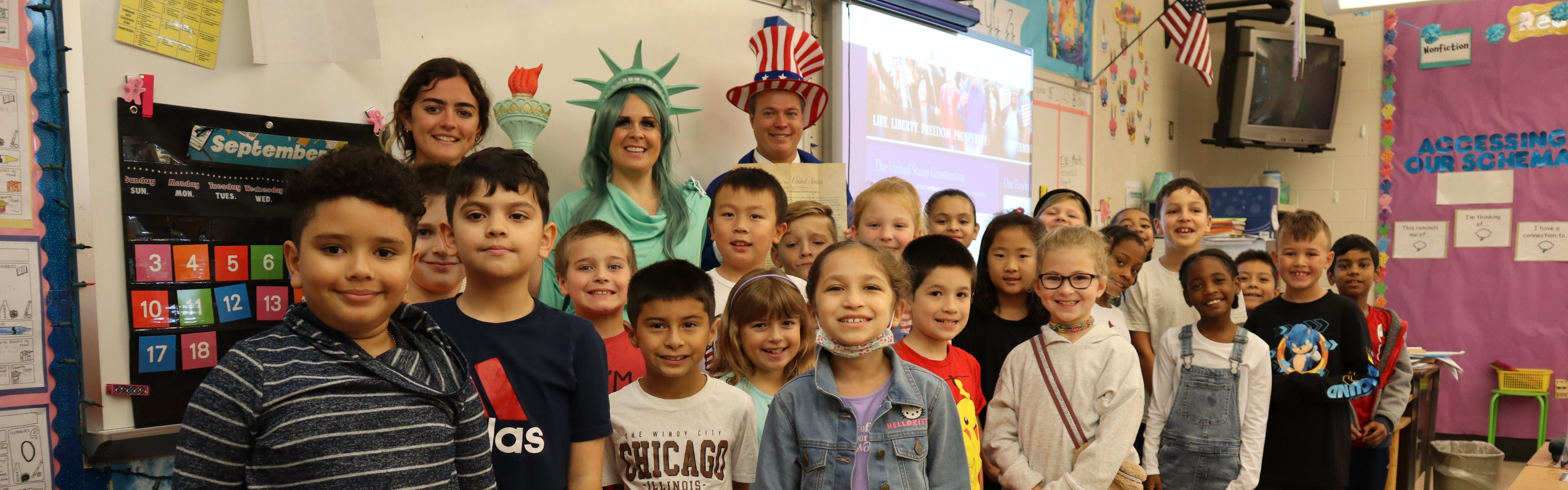 UMIS classroom poses with Ms. Rhoads and Dr. Bair on Constitution Day