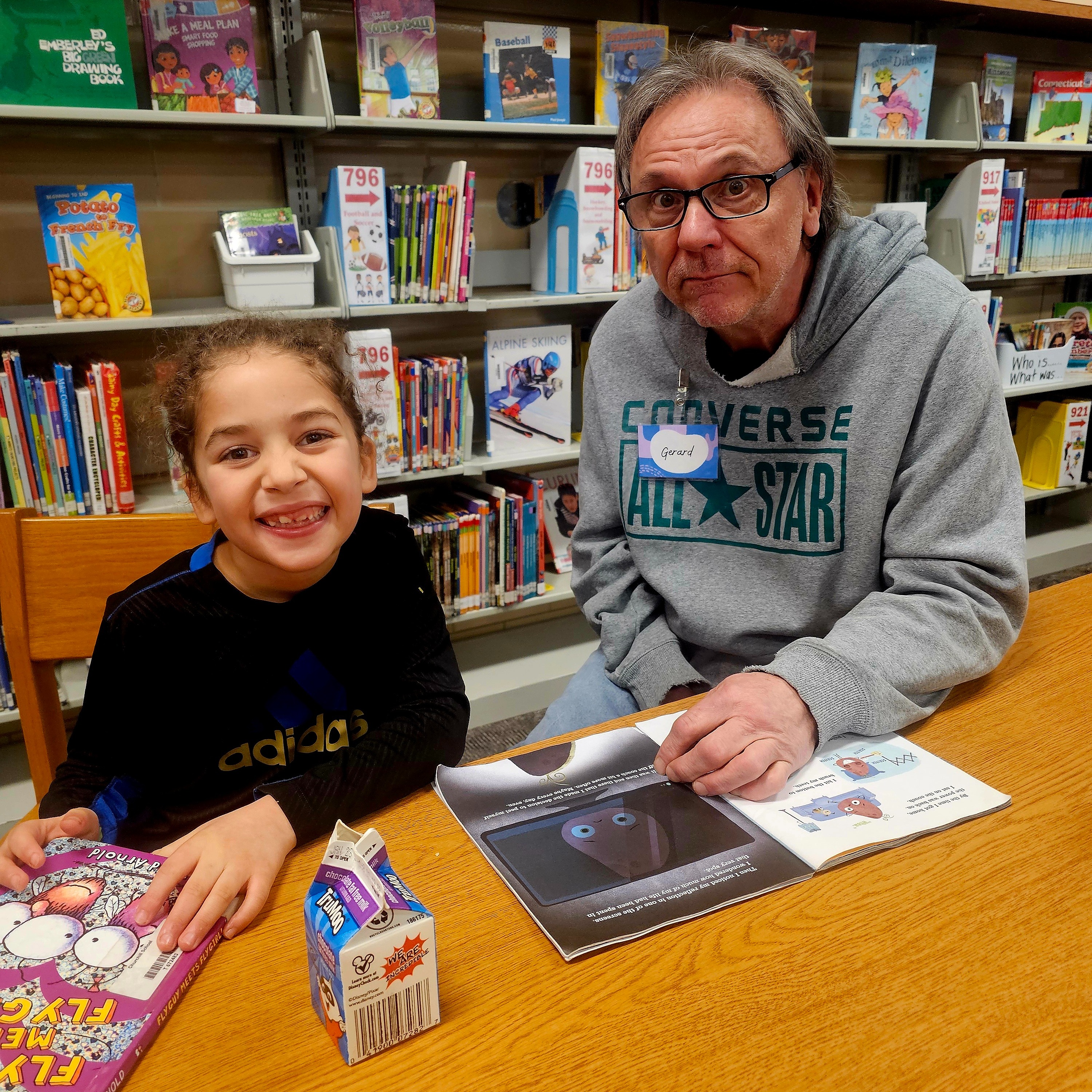 students and teacher reading