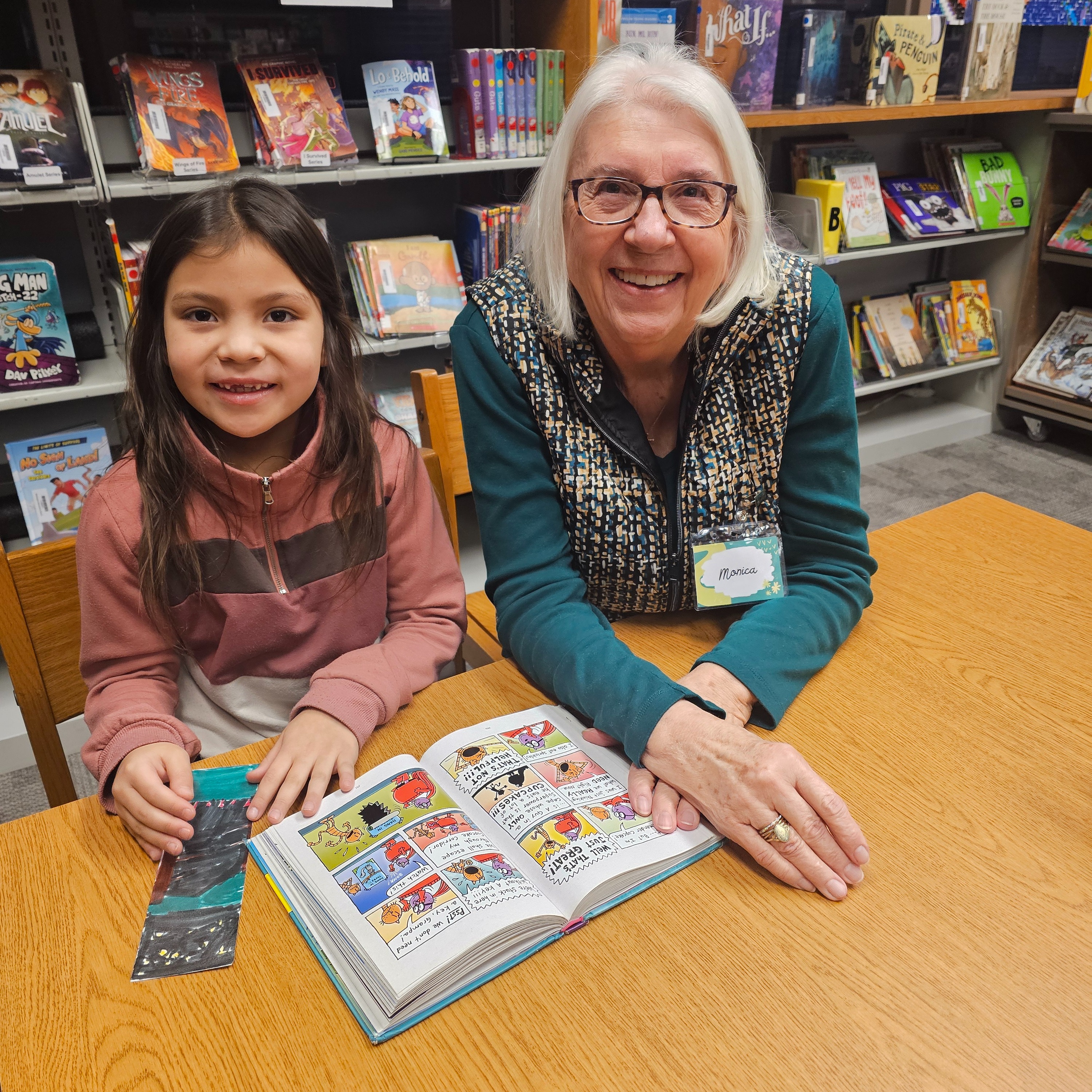 students and teacher reading