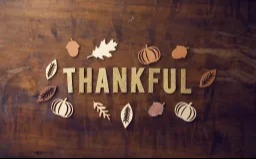 The word written in a wood table with fall items around