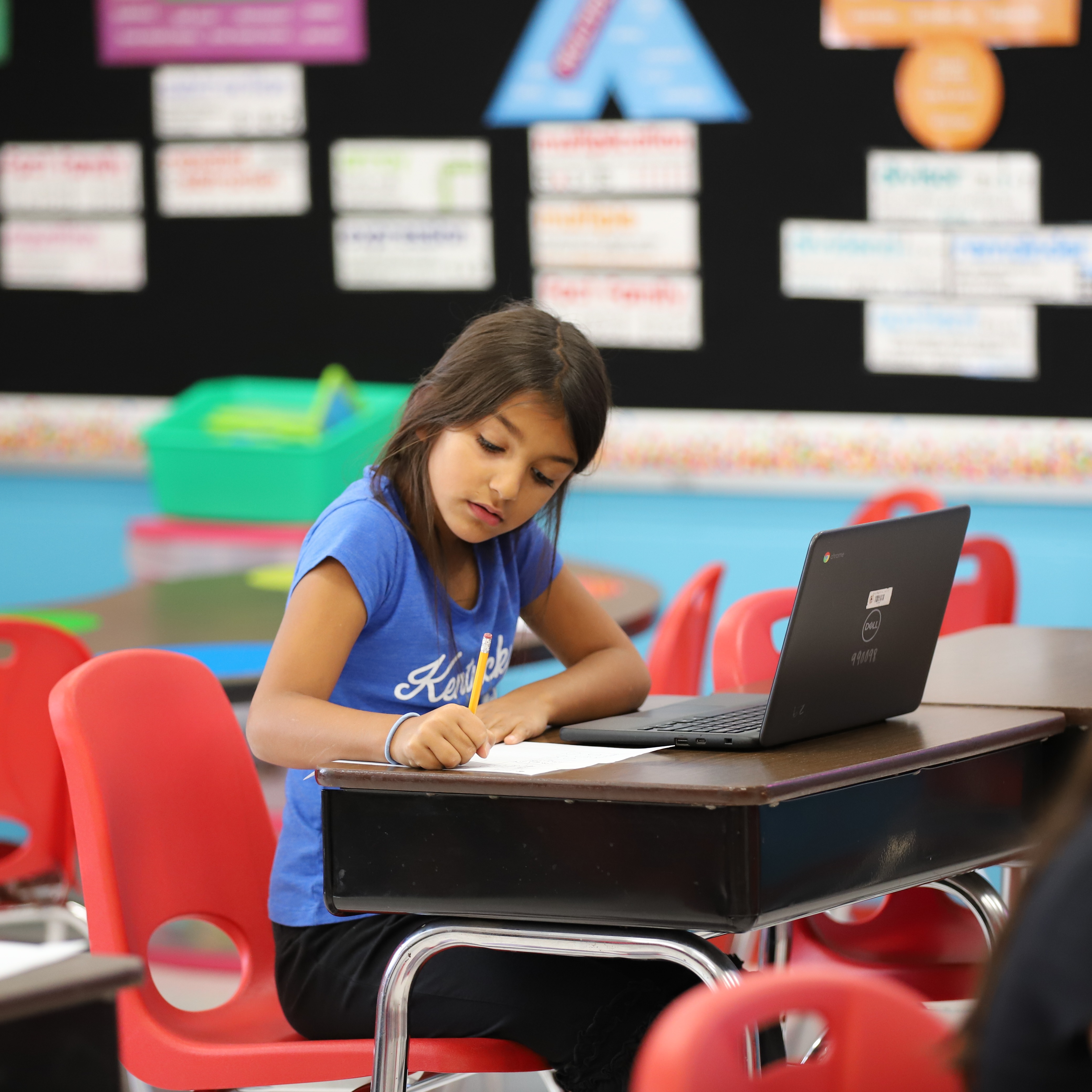 students writing in class