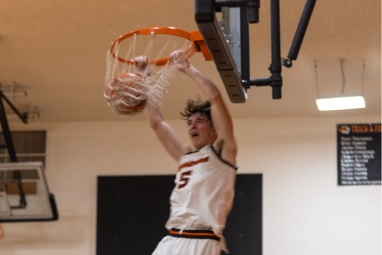 A Napavine High School boys basketball player dunks the basketball during a road game at Toutle Lake