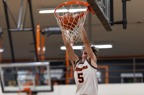 A Napavine High School boys basketball player dunks the basketball during a road game at Toutle Lake