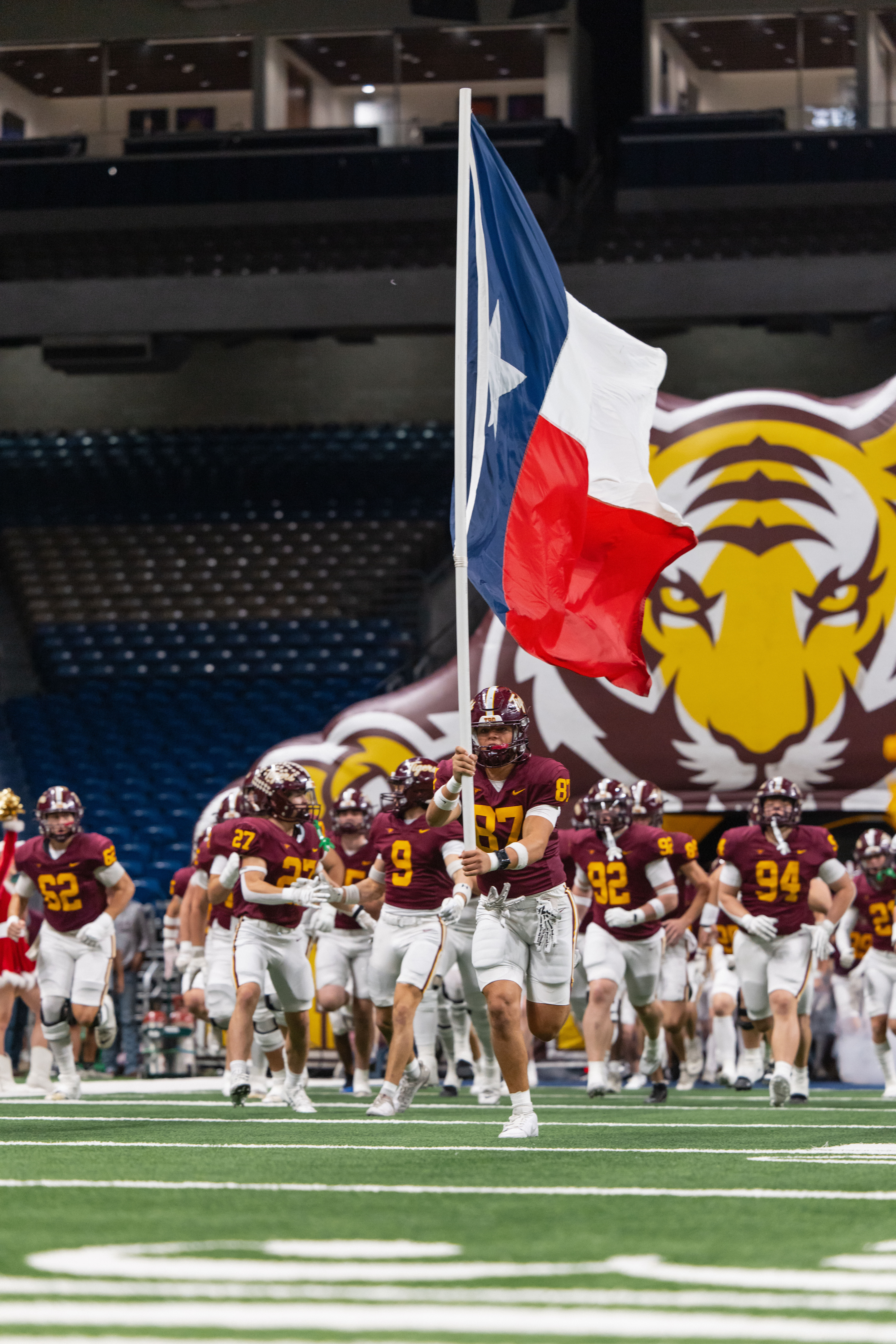 football team runs on to field