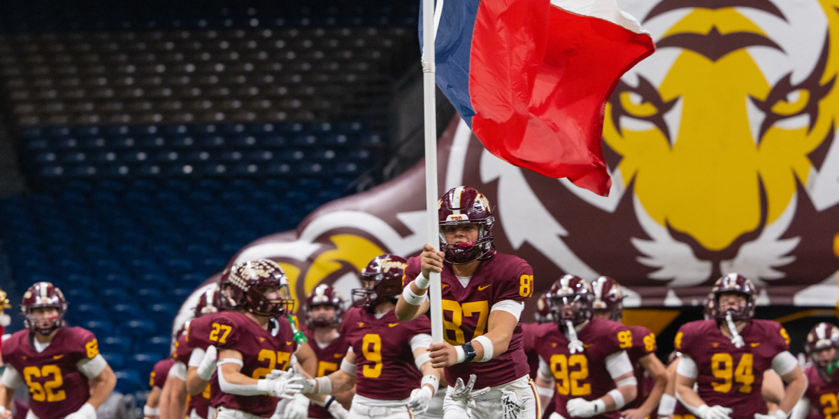football team runs on to field
